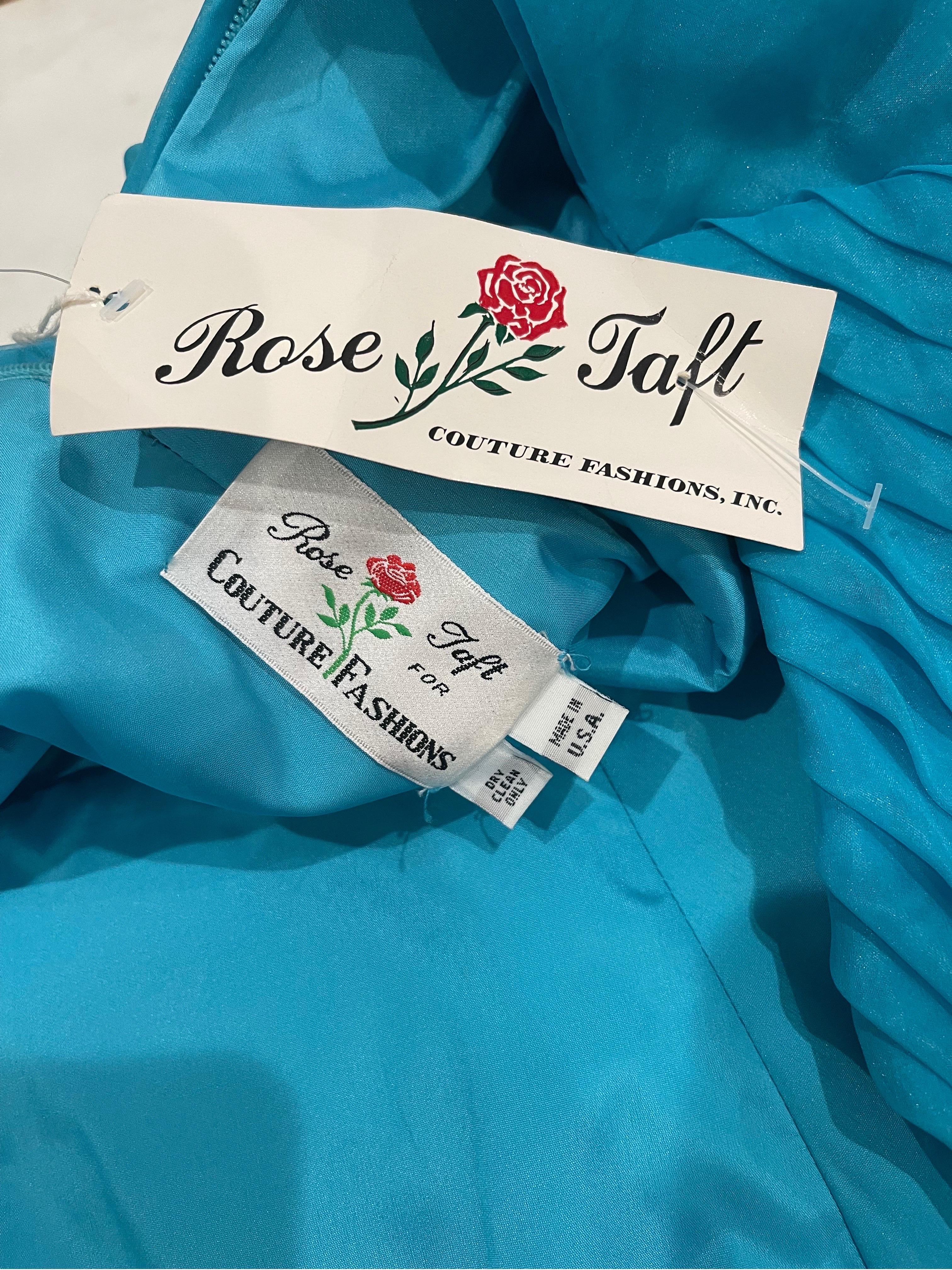 Beautiful NWT deadstock 1980s ROSE TAFT COUTURE turquoise blue chiffon puff sleeve gown ! This dress really takes style to the next level. Pleated tailored bodice with Avant Garde puff sleeves. Flower appliqué adorned with rhinestones and pearls.