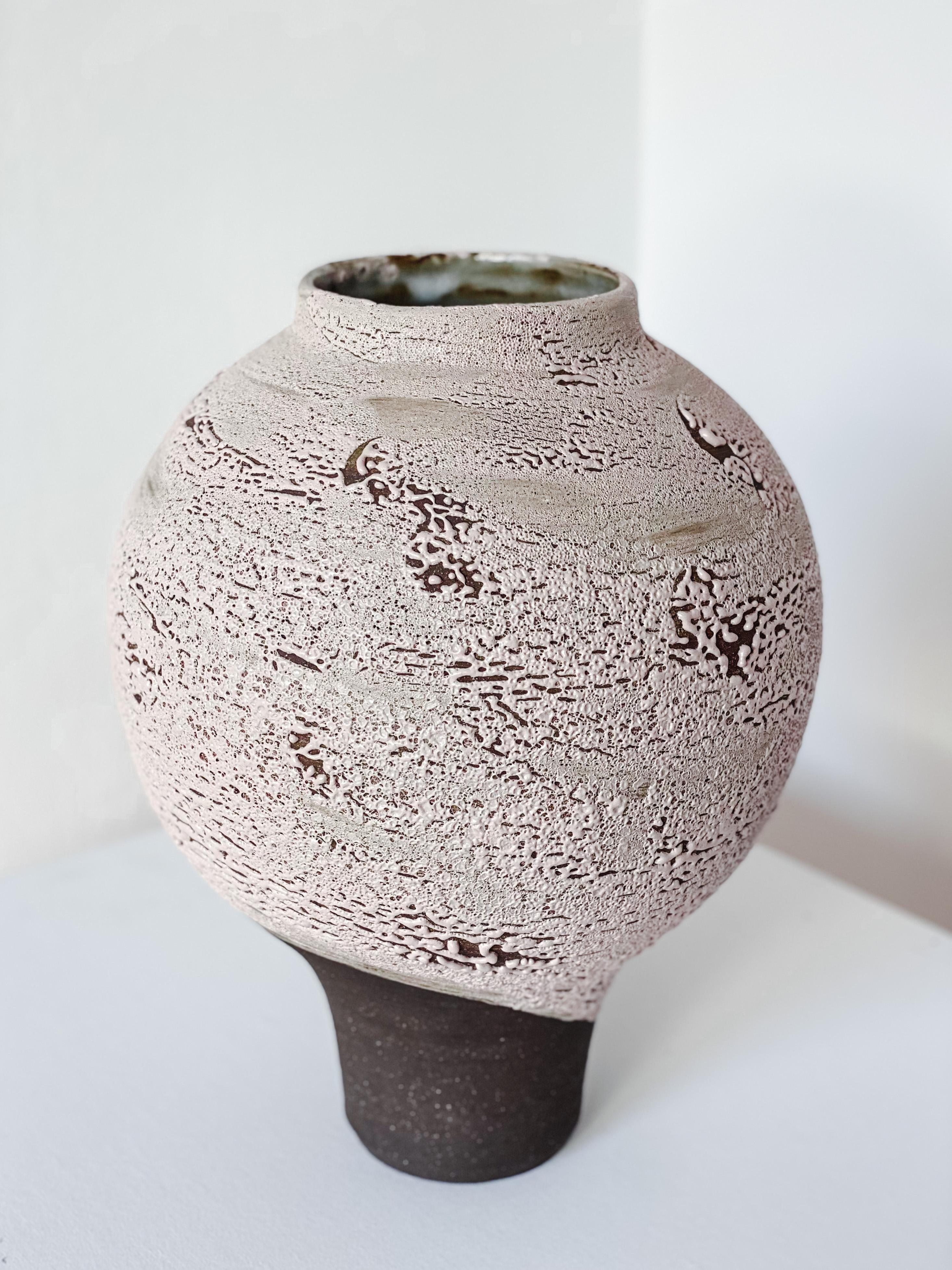 Rosè vase by Arina Antonova, 2021
Dimensions: H 40 x D 36 cm
Materials: Black stoneware, soft pink glaze.

Born in Sewastopol (Crimea), I was surrounded by the natural variety of the coastal Black Sea views with rocky beaches and picturesque