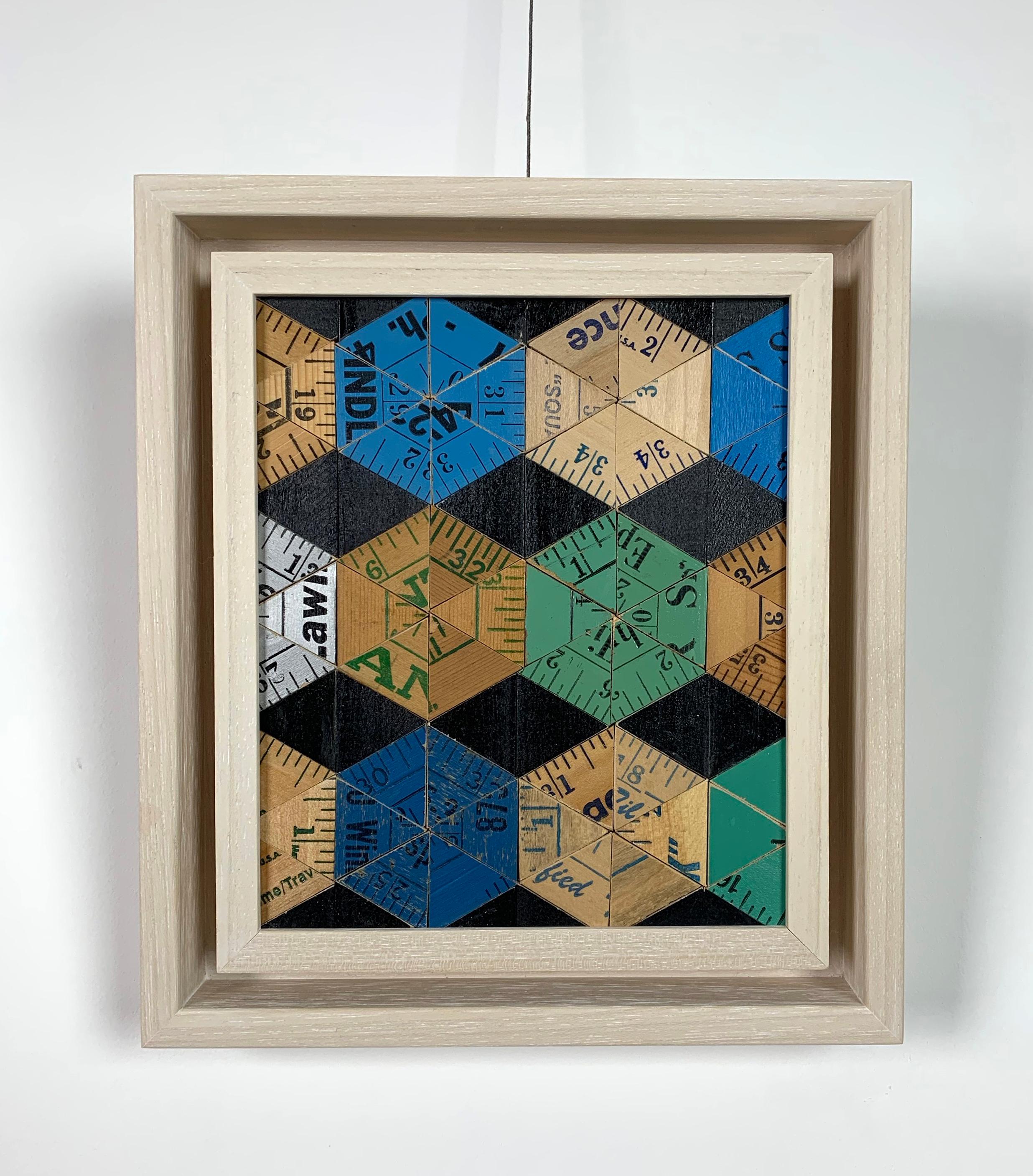 Test Card (Blues) by Rose Vickers. 

Medium: recycled yardsticks & rulers. 

Since completing her degree in Applied Arts, Rose has exhibited widely and worked on a broad range of public and private commissions. Her chosen medium consists of found