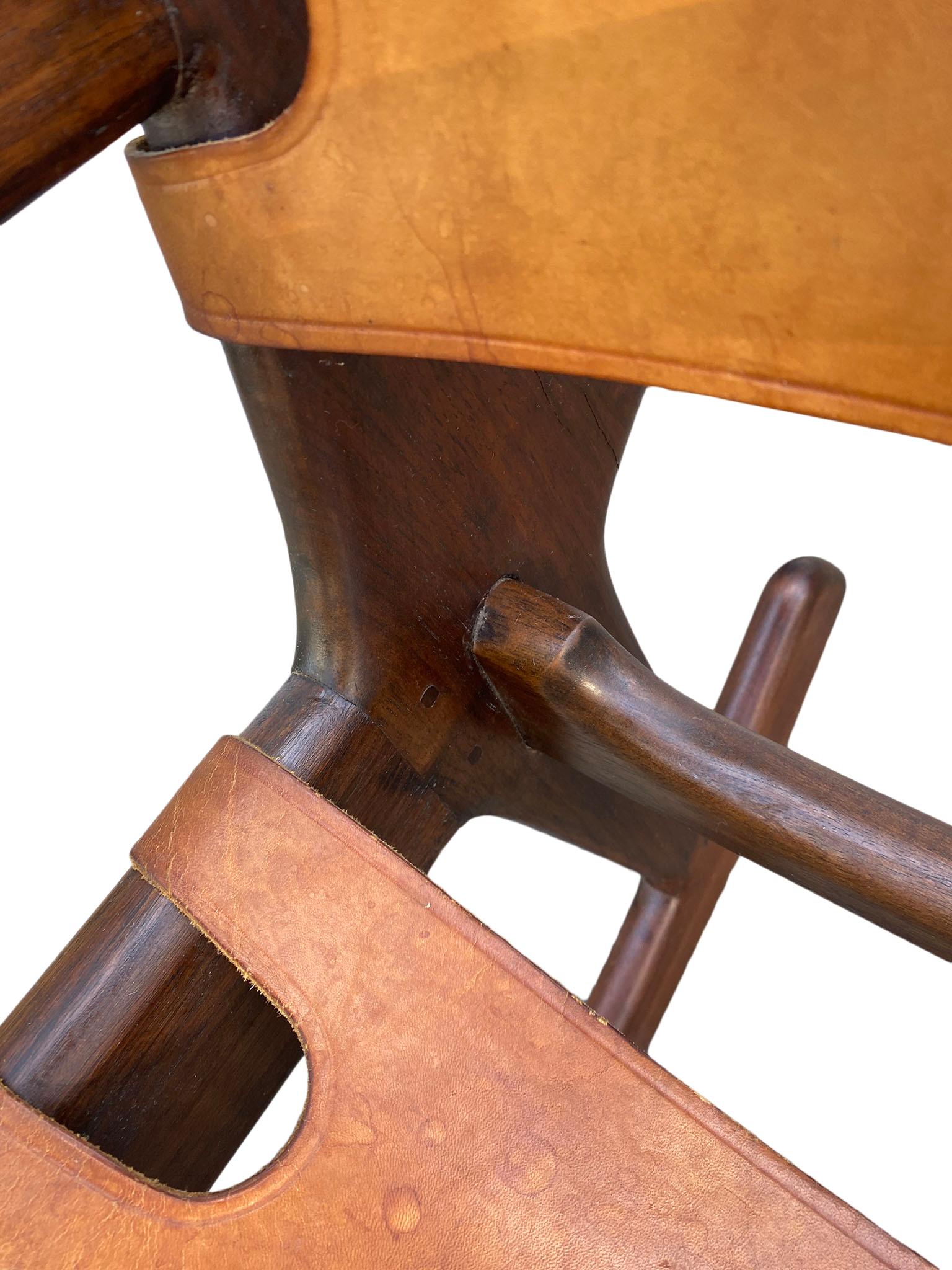 Ecuadorean Rose wood and leather sling rocking chair by Ecuadorian designer Angel Pazmino