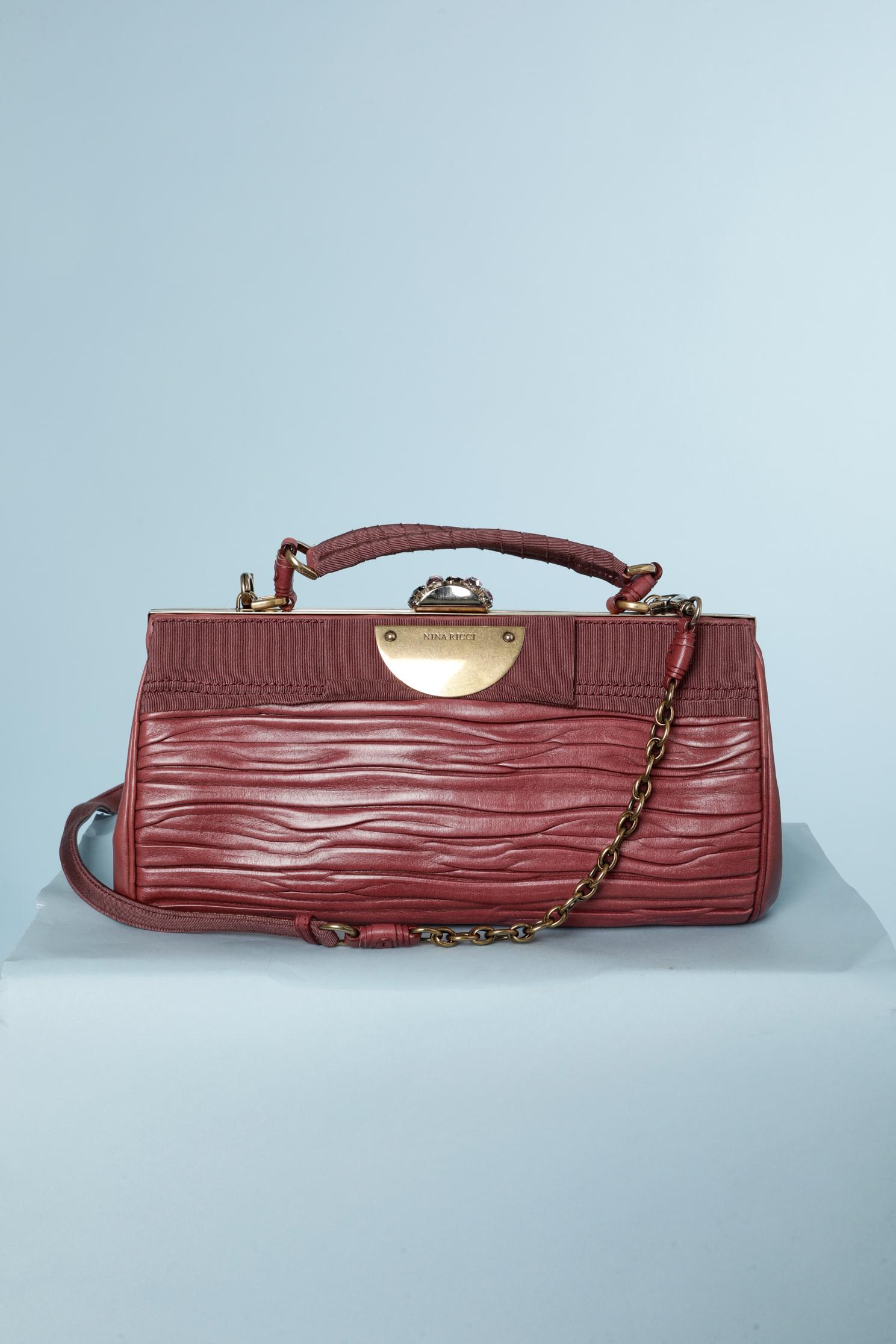 Rose wood color pleated leather and gros-grain shoulder  bag.
Short bag handle: 30 cm
Long bag handle ( detachable) : 120 cm 
Jewelry rhinestone bag clasp.
Pale pink cotton lining and 2 flats pockets inside.
One zipped pocket on the back of the bag.