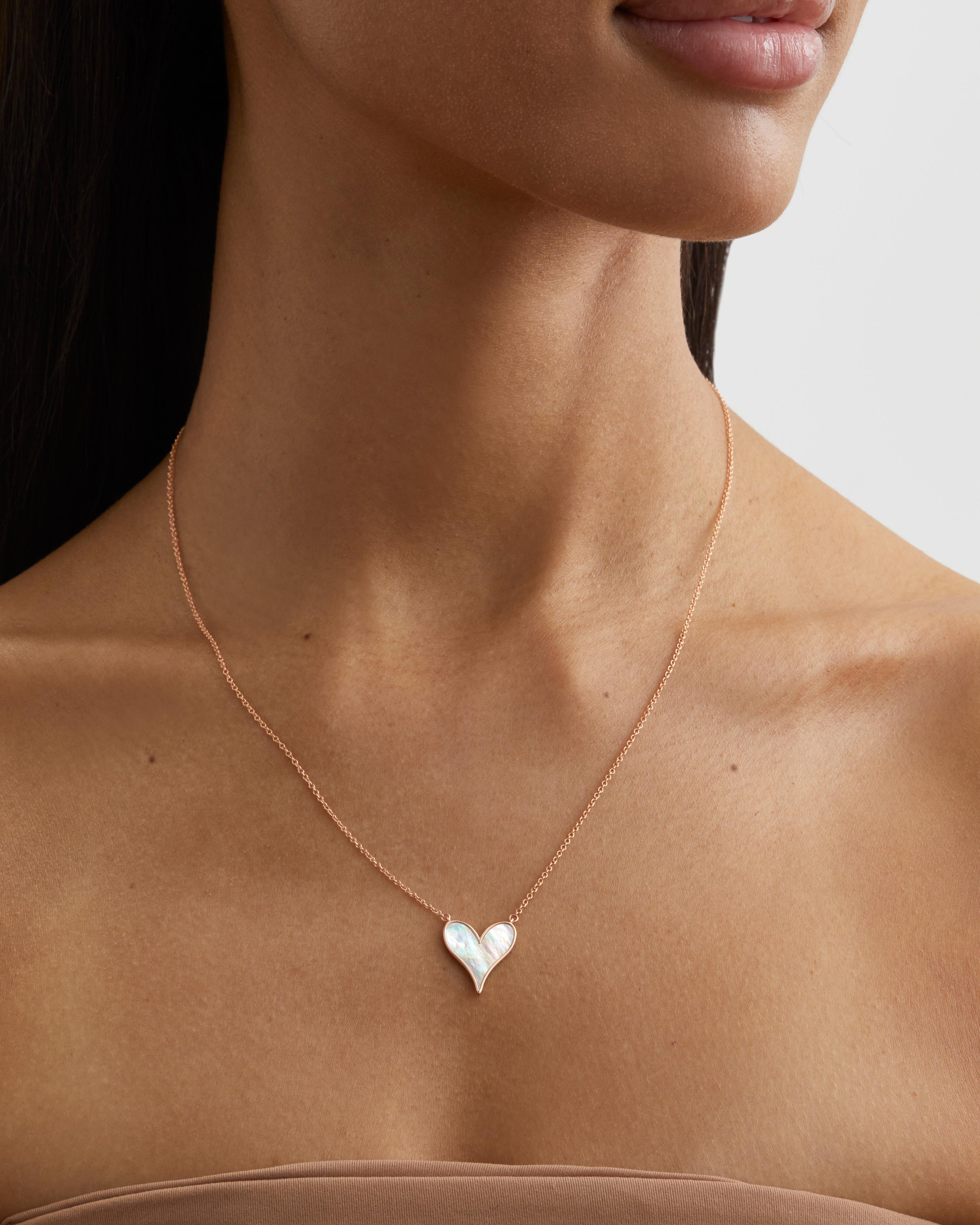 The perfect Heart Pendant. Roseate envisions a heart as twin water drops, joined in love and inlaid with carved mother-of-pearl. To give and wear as sentiment and style.

- 18k Rose Gold
- White Mother-of-Pearl, 15mm
- Mother-of-Pearl responsibly
