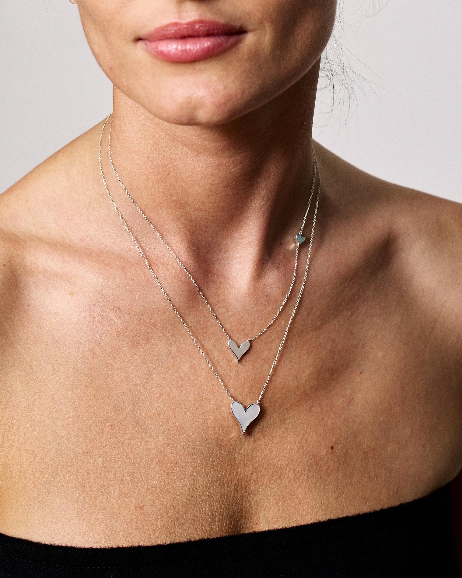 The perfect Heart Pendant. Roseate envisions a heart as twin water drops, joined in love and inlaid with carved mother-of-pearl. To give and wear as sentiment and style.

- 925 Sterling Silver
- White Mother-of-Pearl, 15mm
- Mother-of-Pearl
