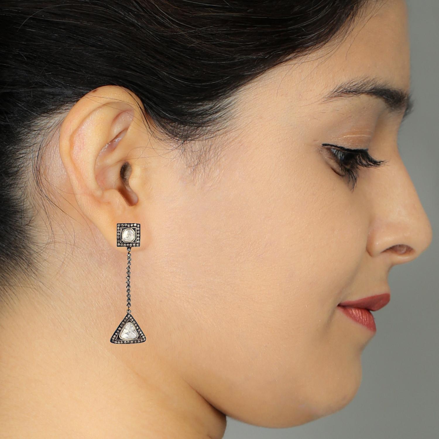 Designer dangle earring with rosecut diamond earring in 18K Gold and silver, is cool yet vintage looking. 

Closure: Push Post

18Kt Gold 5.485gms
Diamond 2.79cts