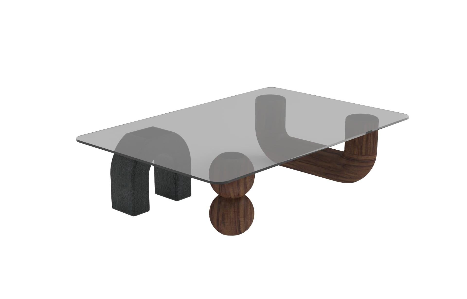 Rosedal coffee table by Comité de Proyectos
Dimensions: 120 x 80 x 30 cm
Materials: Solid Huanacaxtle wood, Volcanic stone, Ray smoked glass

This table was made in collaboration with the Ángulo Cero gallery.
The Rosedal table is a sculptural