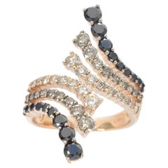 Rosegolden ring with champagne and black colour diamonds