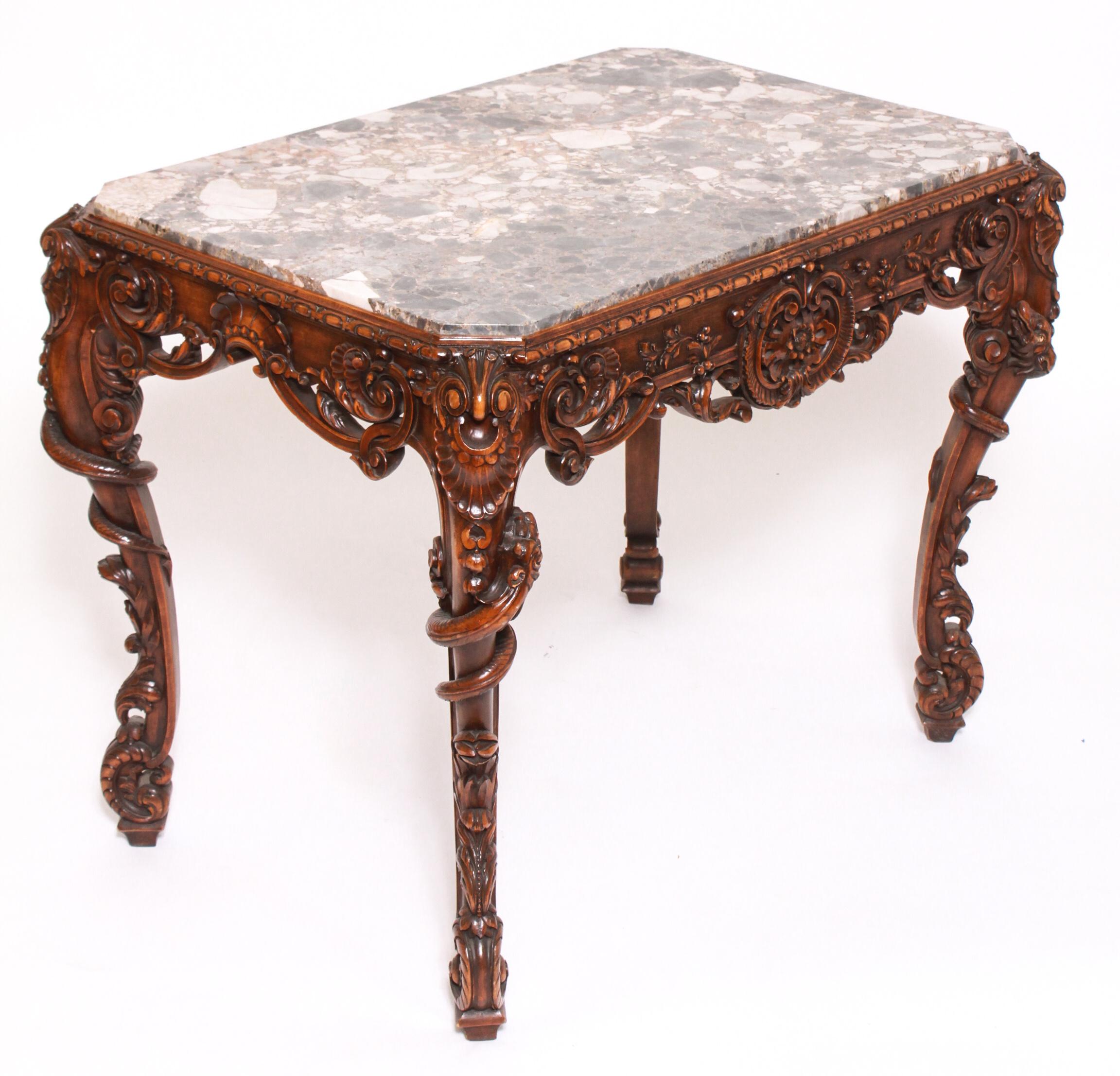 Belgian carved wood and marble-top table, circa 1900, cabriole legs with serpent and foliate motif and scroll form feet, stamped 