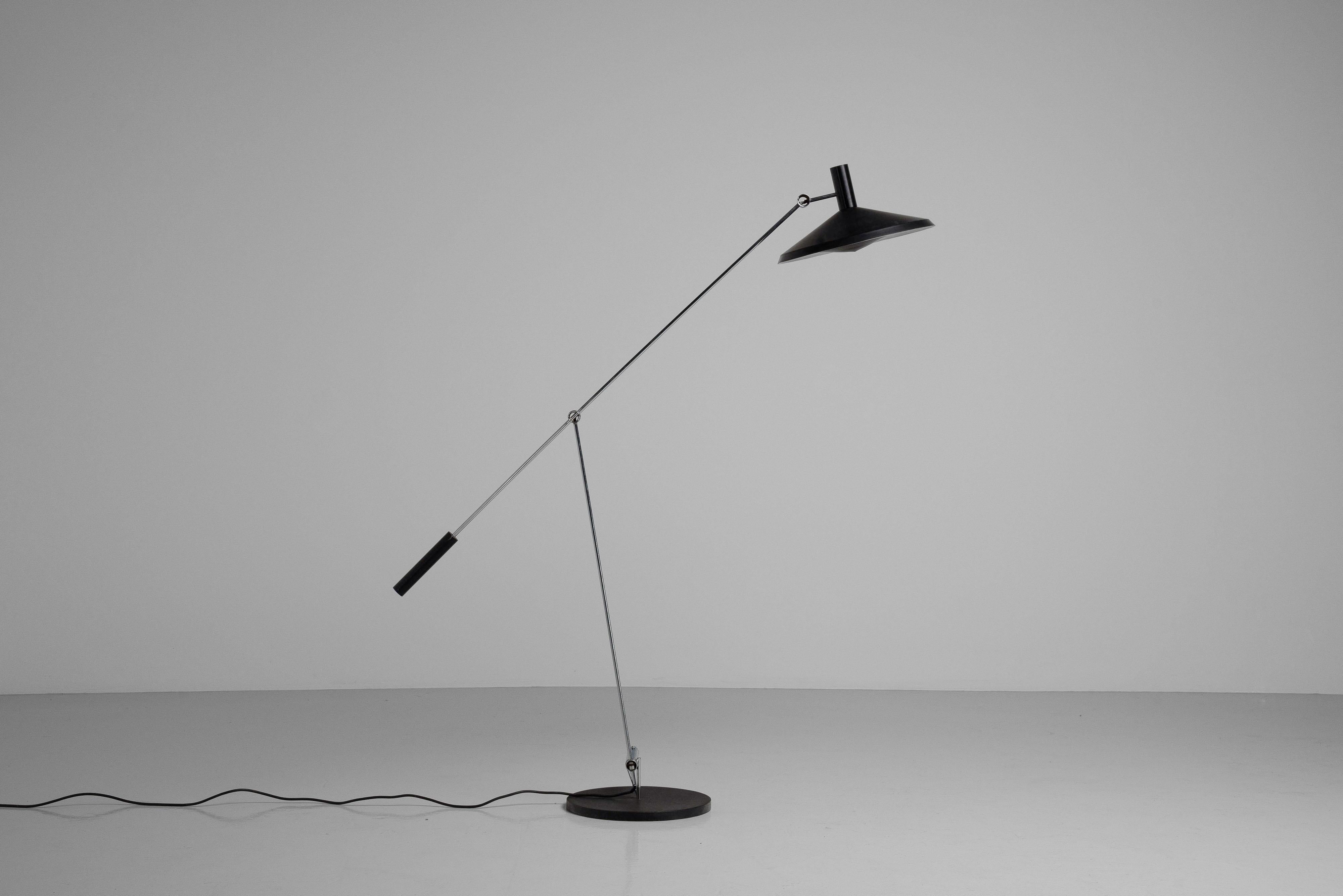 Beautiful and rare early version of the model 600 adjustable floor lamp designed by Rosemarie and Rico Baltensweiler for Baltensweiler AG in Switzerland in 1951. The lamps has a heavy base and a smart way to adjust it. You can change the angle,