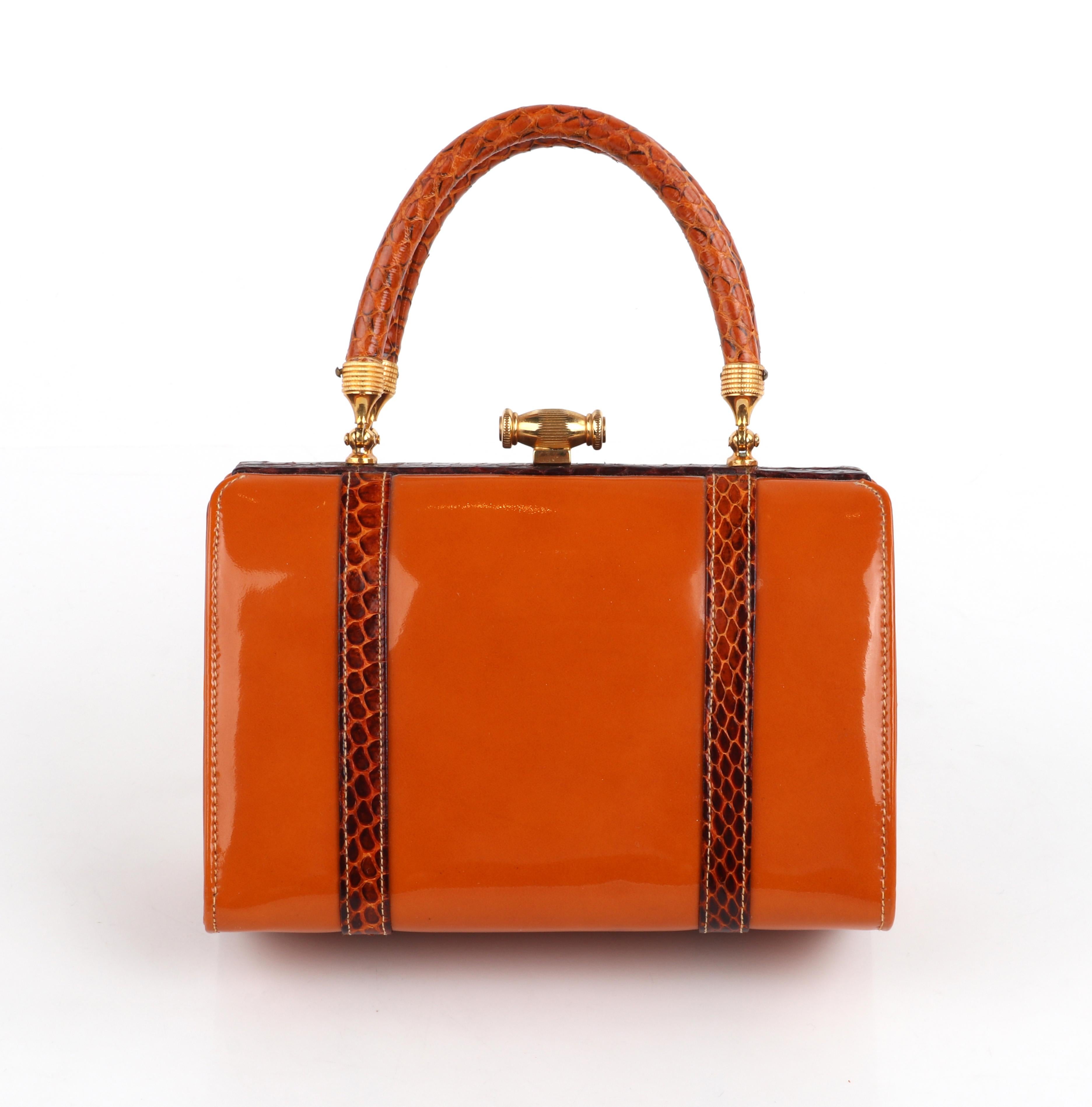 Rosenfeld c.1960's Vtg Orange Patent Leather Snakeskin Embossed Small Structured Handbag w/Coin Pouch & Comb

Circa: 1960's
Designer: Rosenfeld
Style: Top handle bag
Color(s): Tones of orange, brown & gold
Lined: Yes
Unmarked Fabric Content: