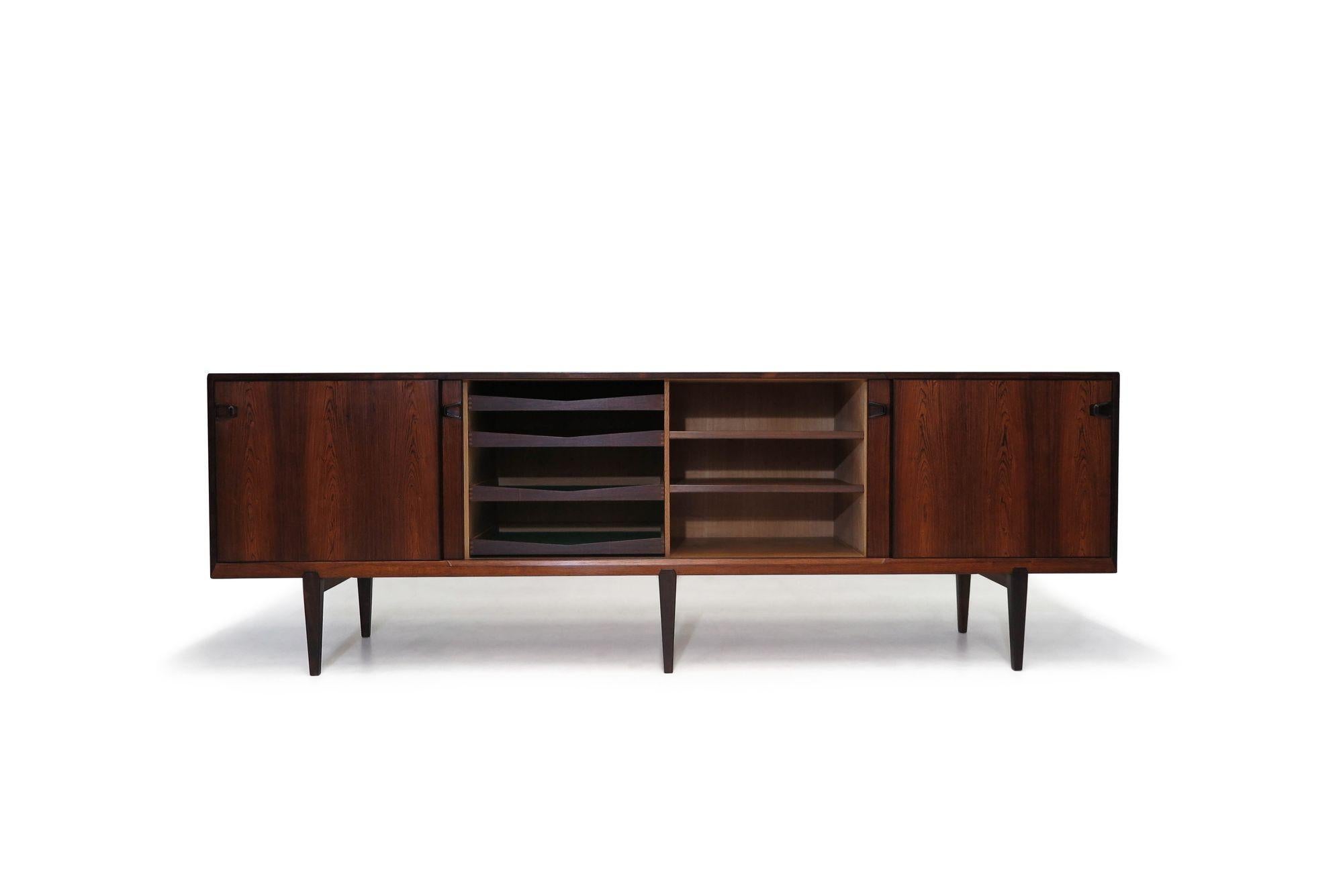 Danish Credenza designed by Henry Rosengren Hansen for Brande Moblefabrik, Denmark c.1955. This beautiful 97” long credenza is expertly hand-crafted from Brazilian rosewood, showcases fine joinery and the timeless sophistication of Danish furniture