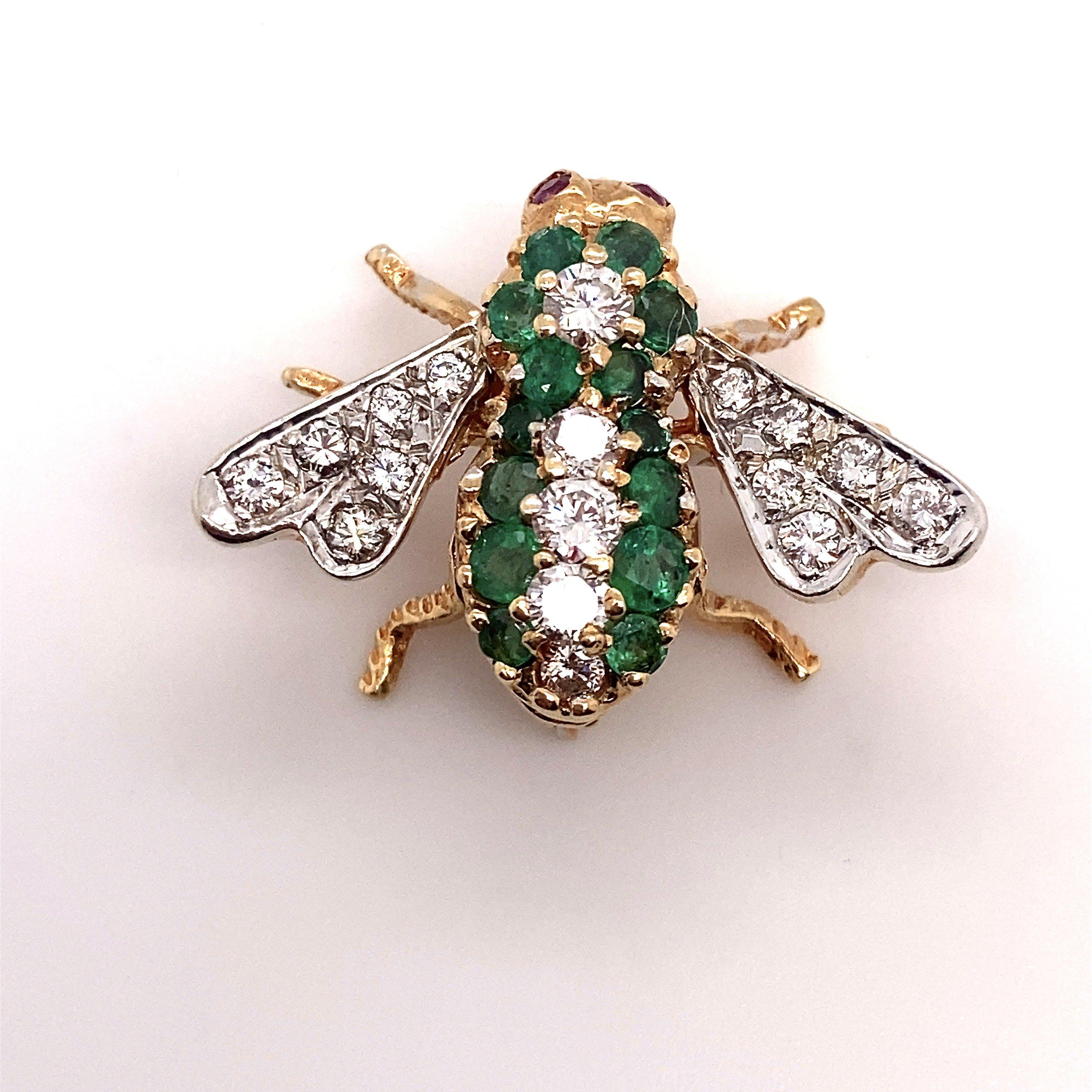 This Rosenthal pin is crafted in 18KT yellow gold with .72CT round diamond & .29CT round emerald with two round ruby eyes. The pin is stamped 18K and HR hallmark. The bee pin measures 19mm x 25mm. The weight is 5.9 grams.  Why we love it: We love