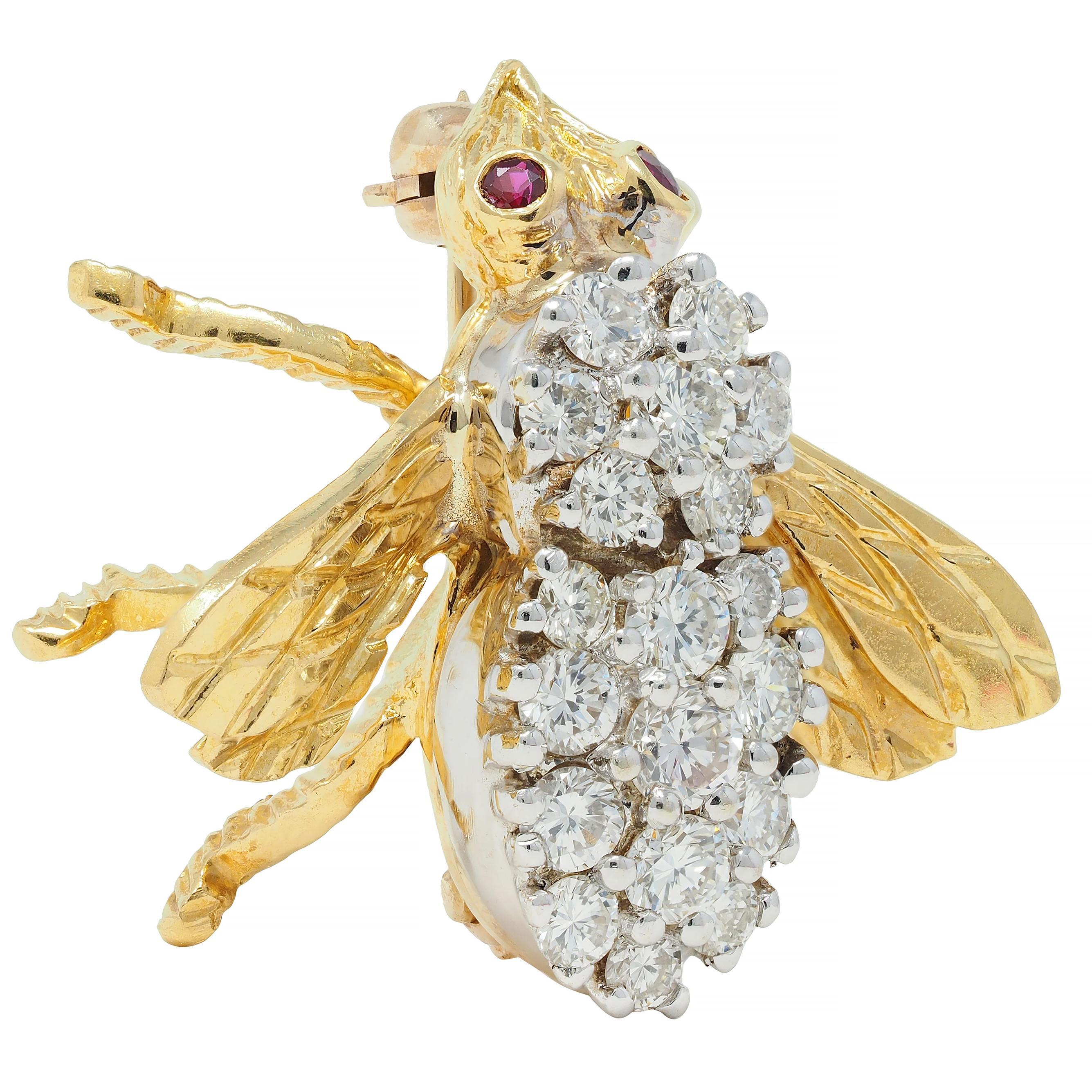 Designed as a stylized bee with deeply engraved wings and textured legs
With round cut ruby eyes - transparent purplish red in color
Weighing approximately 0.10 carat total - bezel set
With round brilliant cut diamonds bead set on body
Weighing