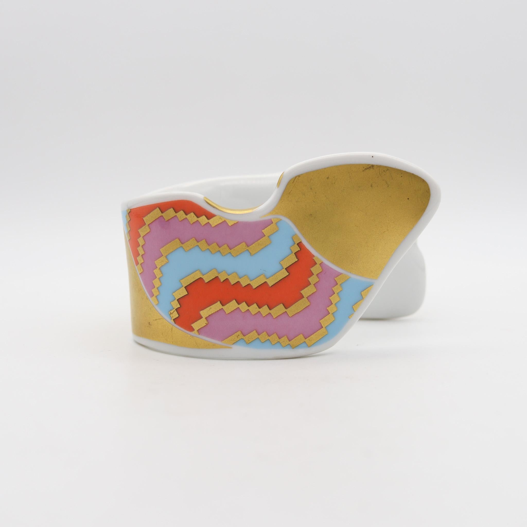 A porcelain cuff bracelet designed by Johan Gerard van Loon for Rosenthal.

This is a very rare retired statement bracelet made by Dutch artist Johan Van Loon for the German porcelain company of Rosenthal, back in the 1970's This beautiful abstract