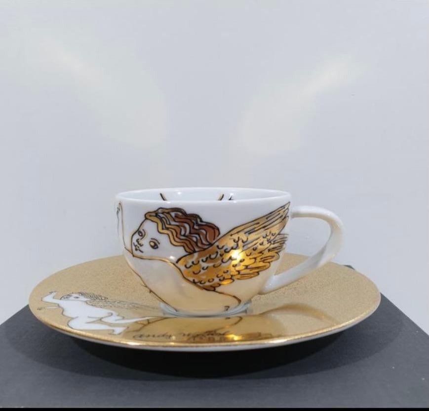 Rosenthal Studio-Line Andy Warhol Christmas Golden Angels espresso cup with saucer. Andy Warhol, quite possibly the greatest pop artist of our time, loved Christmas and was known for giving his friends paintings of cupids as gifts. These particular