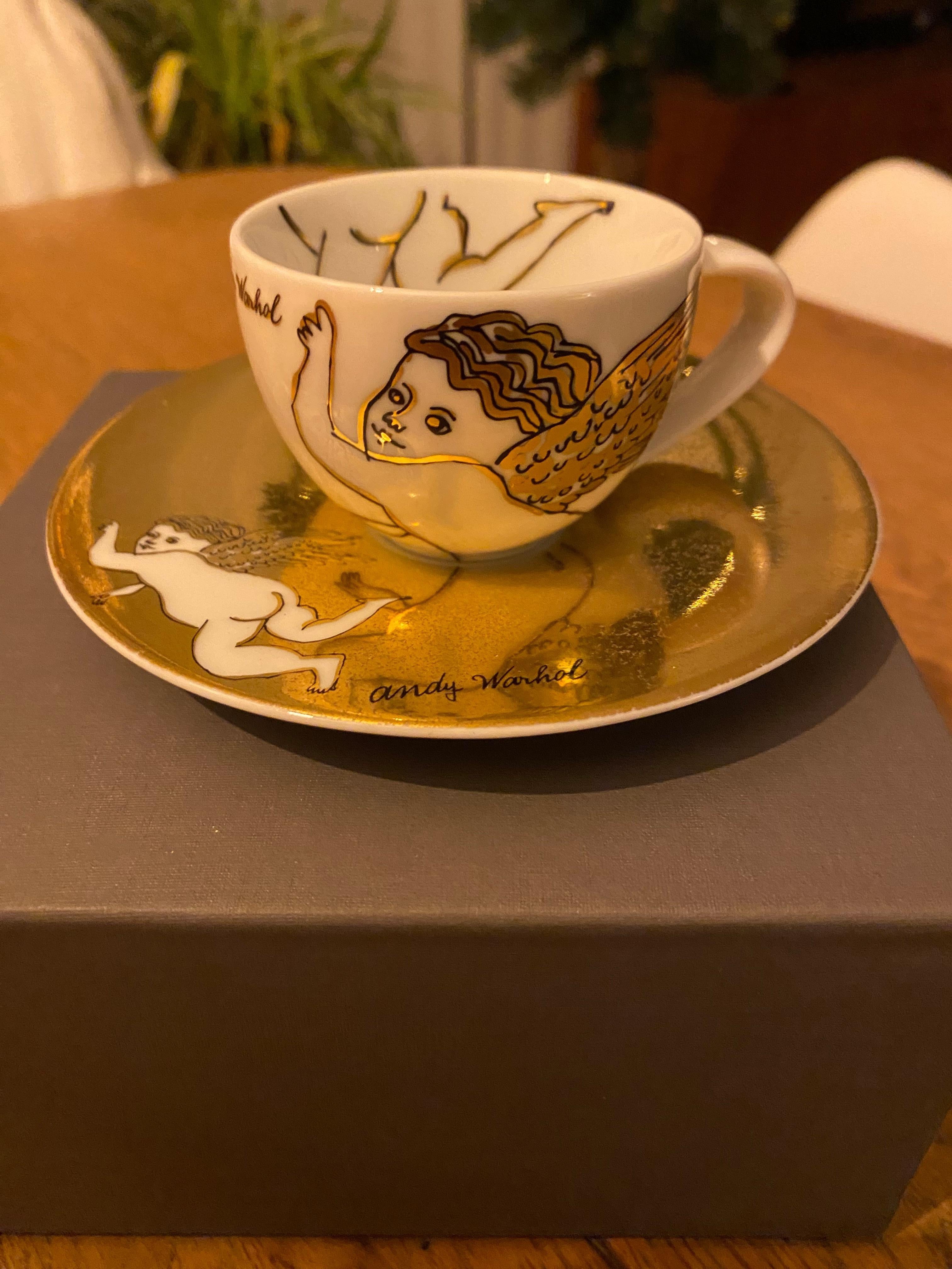 Rosenthal Studio-Line Andy Warhol christmas golden Angels espresso cup with saucer. Andy Warhol, quite possibly the greatest pop artist of our time, loved Christmas and was known for giving his friends paintings of cupids as gifts. These particular