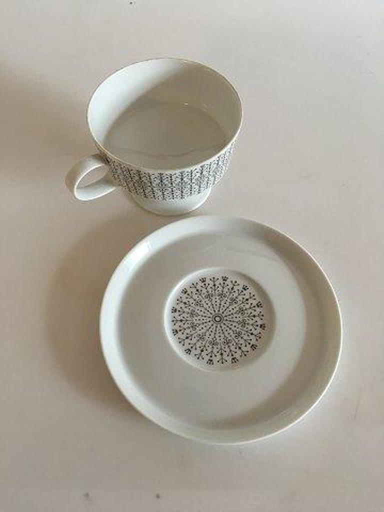 Rosenthal Bjorn Wiinblad designed cup on foot with saucer. White with grey pattern. 

Cup measures 7 x 9.5 cm (2 3/4