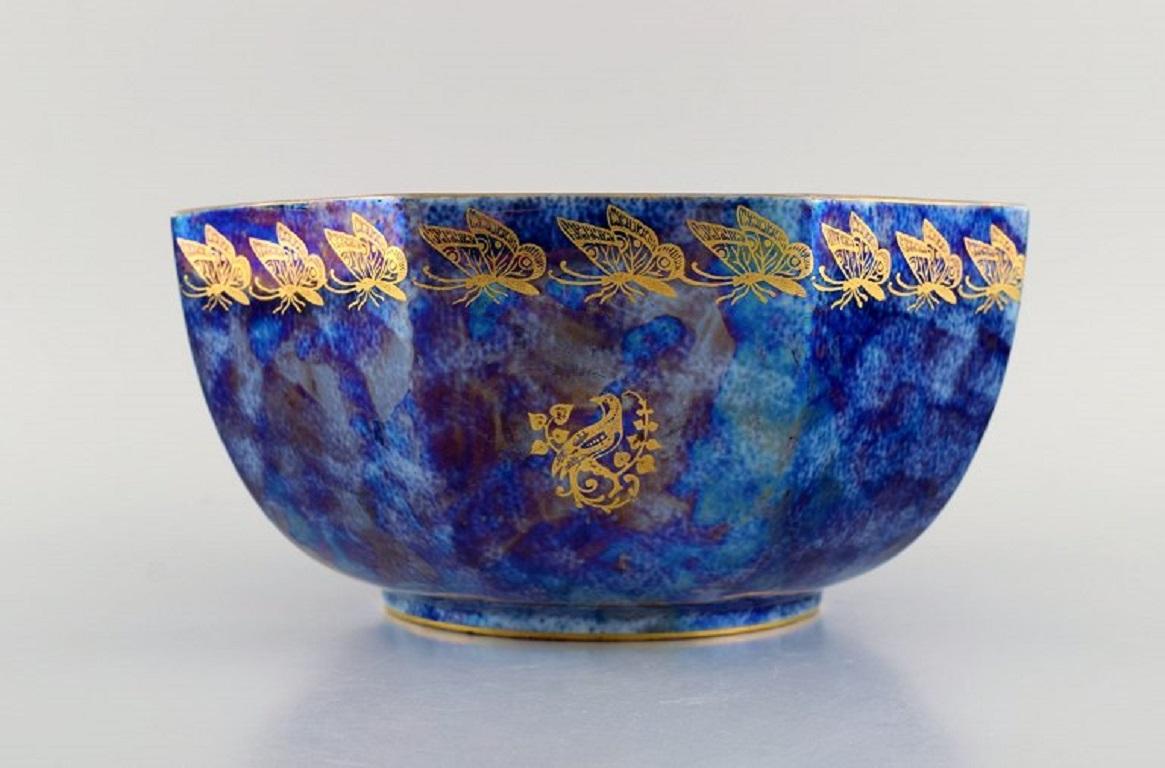 Rosenthal bowl in orange and blue glazed porcelain with hand-painted butterflies and gold decoration. 
1920s / 30s.
Measures: 23.5 x 13 cm.
In excellent condition.
Stamped.
