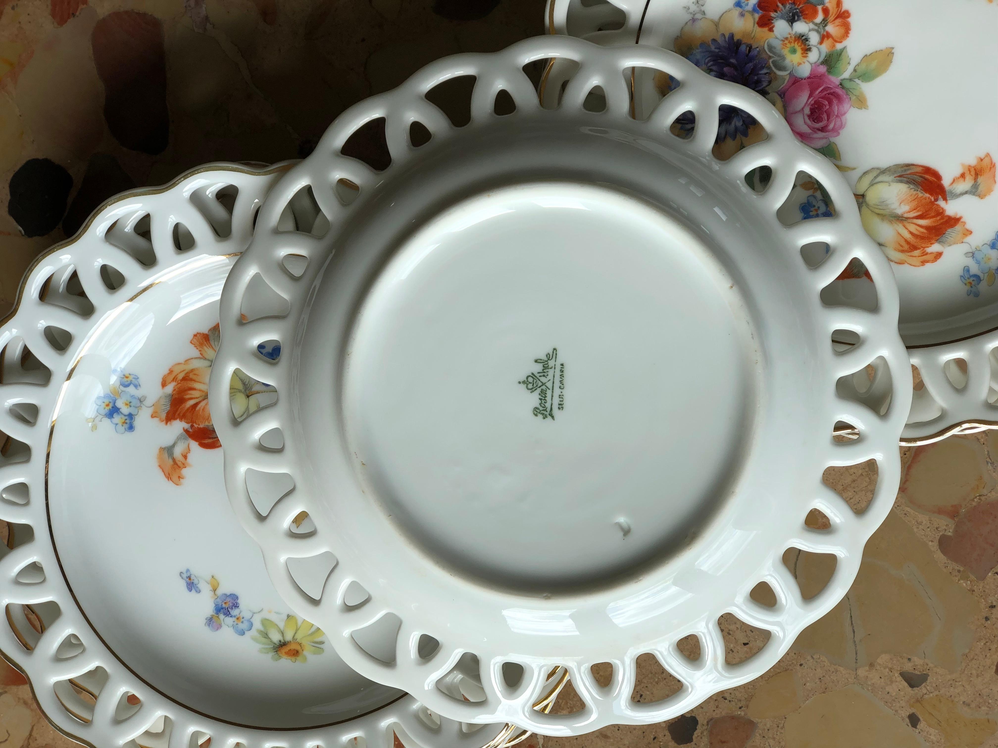 Rosenthal dessert set of eight hand painted porcelain plates all decorated with the same flowers and leaves,
circa 1920.