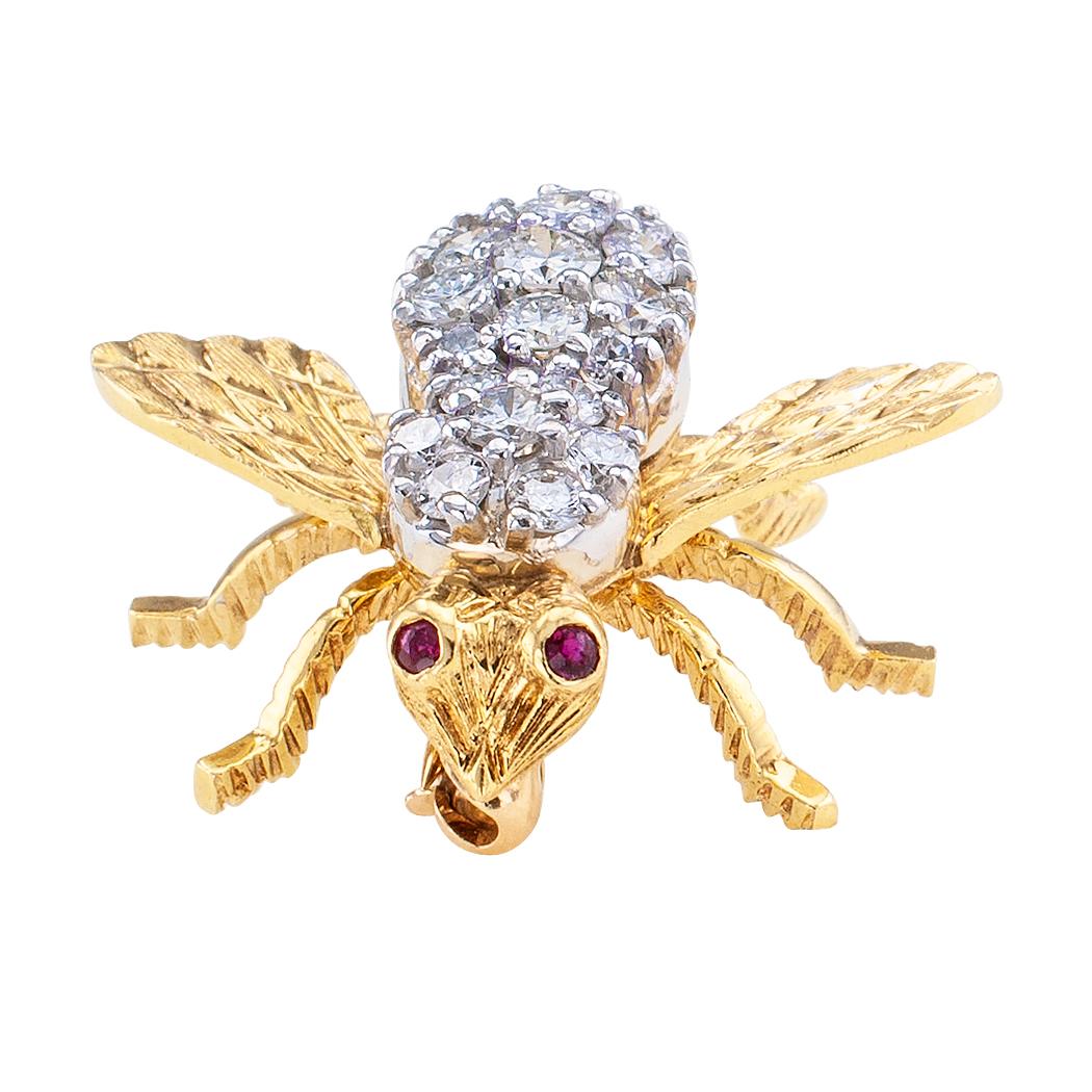 Rosenthal diamond ruby and gold bee brooch circa 1970.

Stones: Diamonds totaling approximately 1.00 carat, along with ruby eyes.
Metal:   18 karat gold.
MEASUREMENTS:  approximately 7/8” long and 1