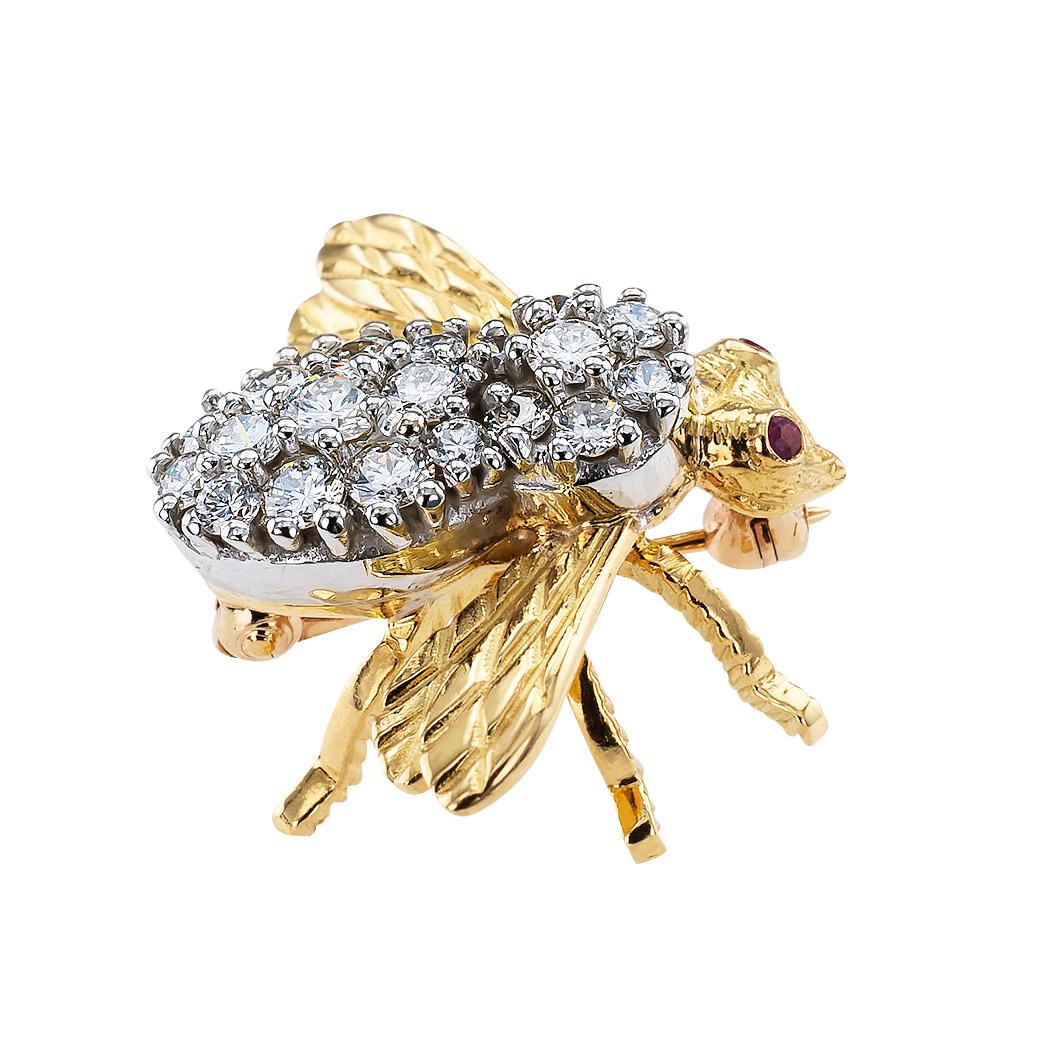 Rosenthal diamond ruby and gold bee brooch circa 1980.

DETAILS:

DIAMONDS:  nineteen round brilliant-cut diamonds totaling approximately 0.75 carat, approximately G color, VS clarity.

GEMSTONES:  2 ruby eyes.

METAL:  18-karat Yellow and White