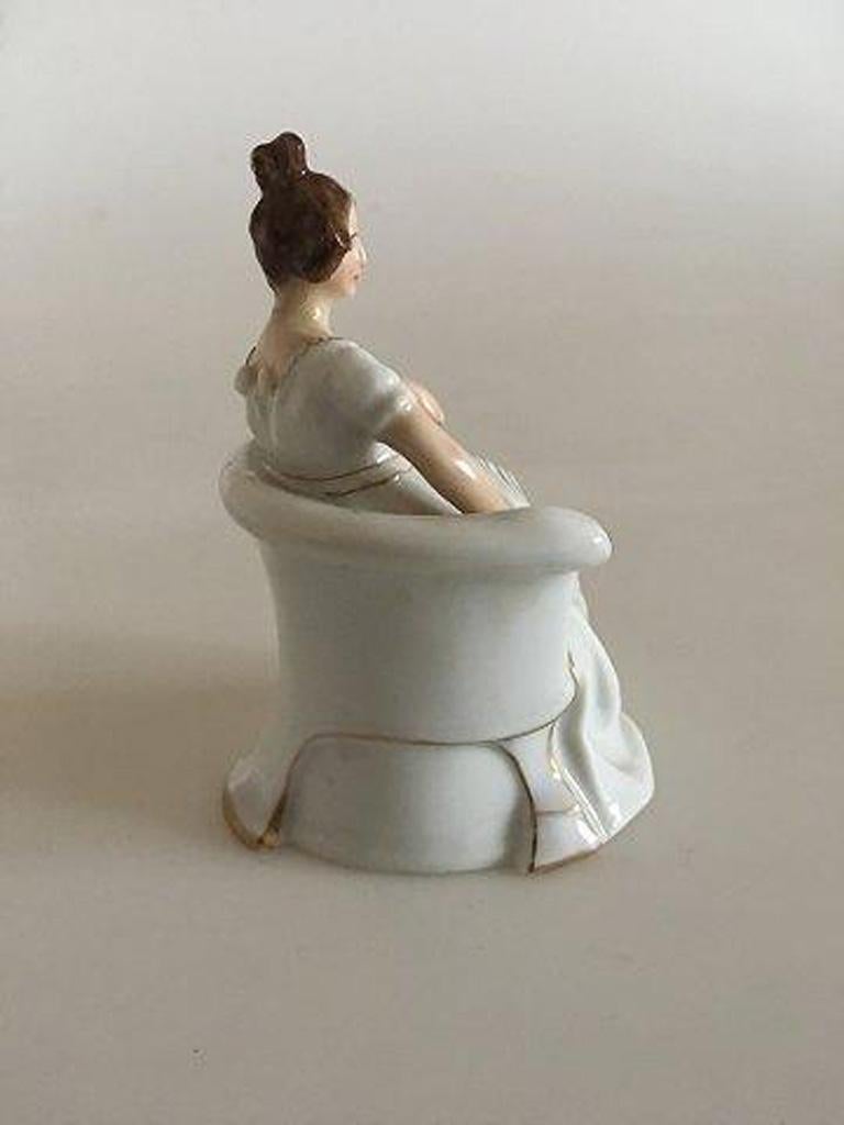 Rosenthal figurine of elegant lady in armchair. The figurines head have chipped off and glued on again.

Measures: 8 cm H (3 5/32