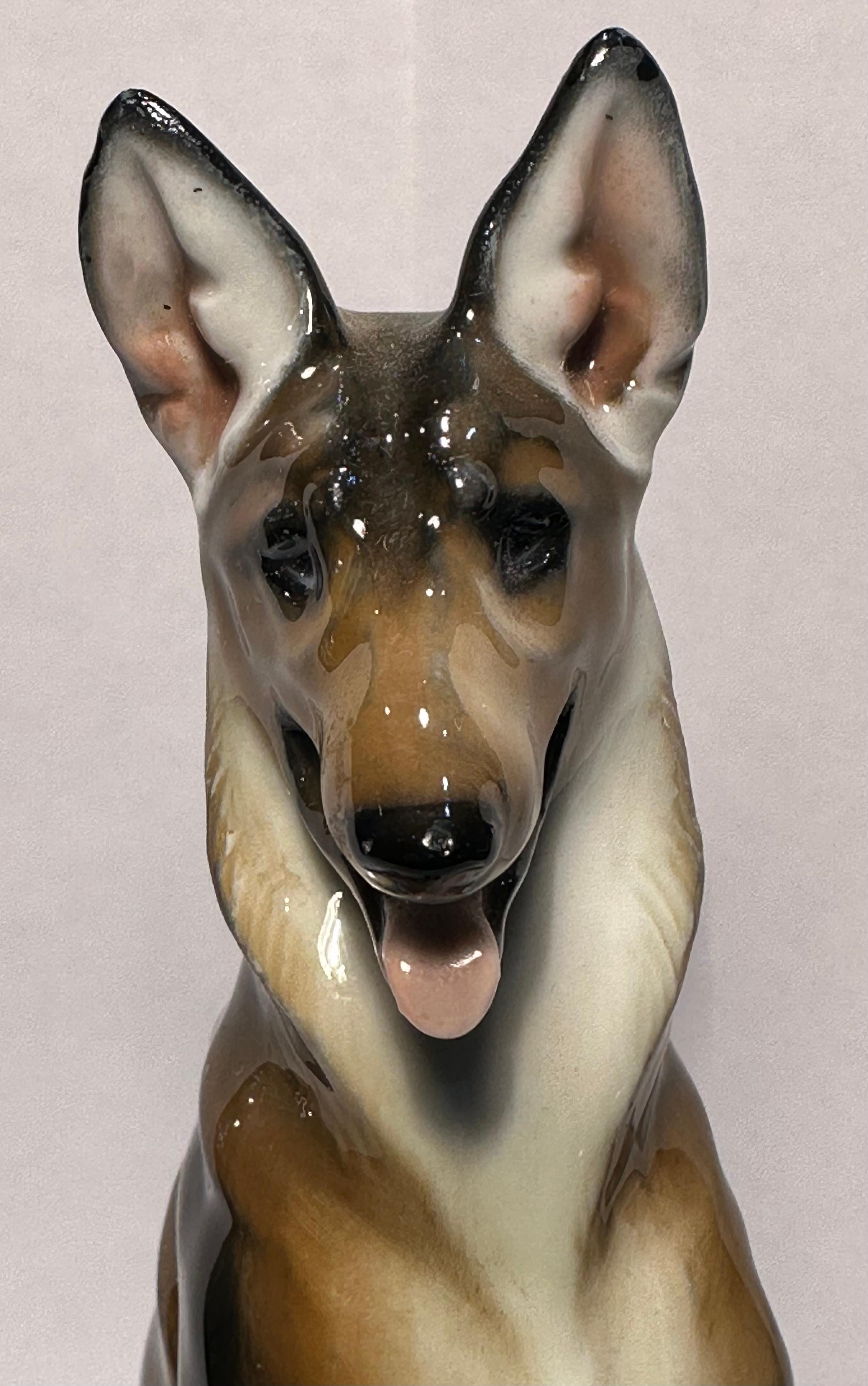 Finest quality, vintage retired, handmade and hand painted in Germany, Rosenthal porcelain German Shepherd dog figurine by artist Theodor Karner for Rosenthal Porcelain Factory. The dog has been masterfully handmade and hand painted with great