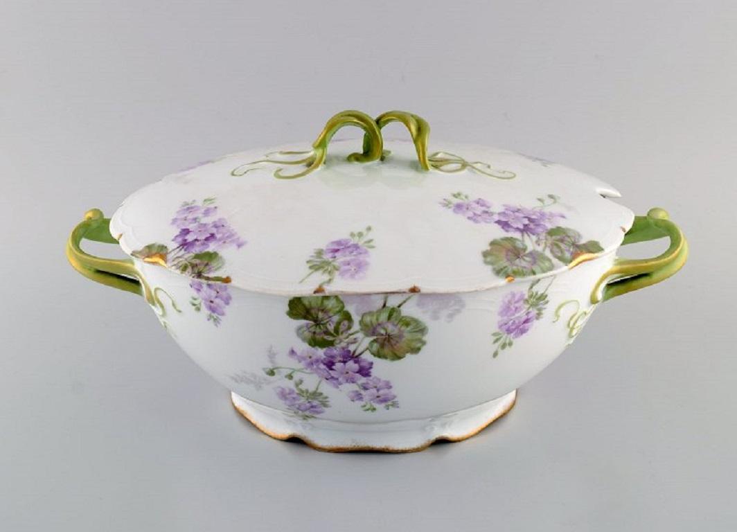 Rosenthal, Germany. 
Large Iris lidded tureen in hand-painted porcelain with flowers and gold edge. Handles modelled as foliage. 1920s.
Measures: 35.5 x 23.5 x 17.5 cm.
In excellent condition.
Stamped.