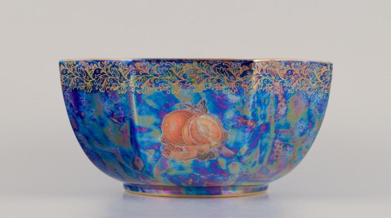 Rosenthal, Germany. Large porcelain bowl in luster glaze. 
Hand-decorated with fruit motifs and gold leaf decoration.
Approximately from the 1930s.
Marked.
Perfect condition.
Dimensions: Height 11.0 cm x Diameter 21.5 cm.