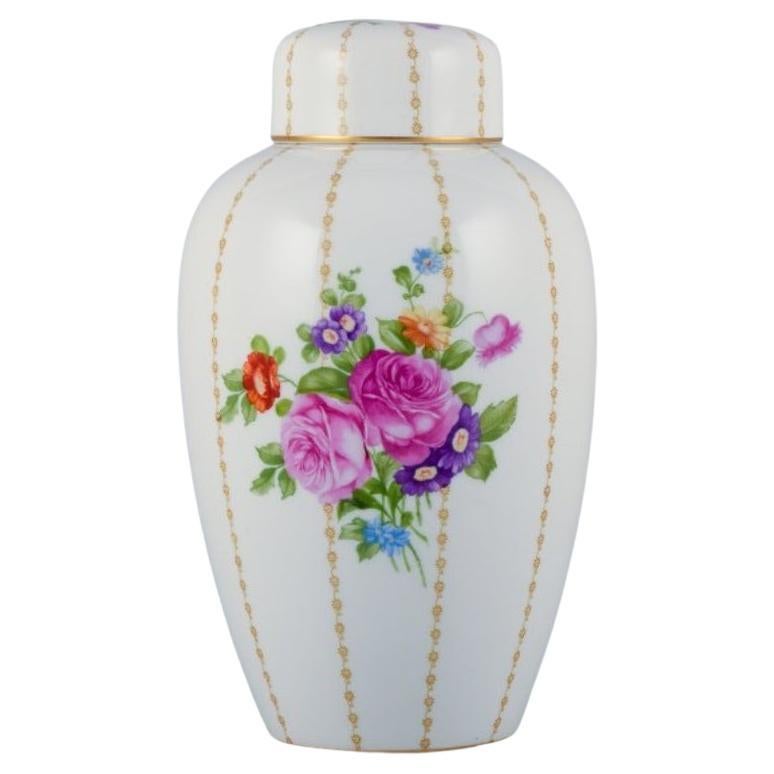 Rosenthal, Germany, large porcelain lidded jar hand-painted with flower bouquets For Sale