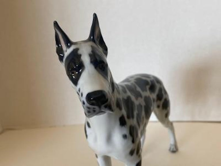 Finest quality, vintage retired, handmade and hand painted in Germany, Rosenthal porcelain “Harlequin” black and white spotted Great Dane dog figurine. The dog has been masterfully handmade and hand painted with great attention to detail by a very