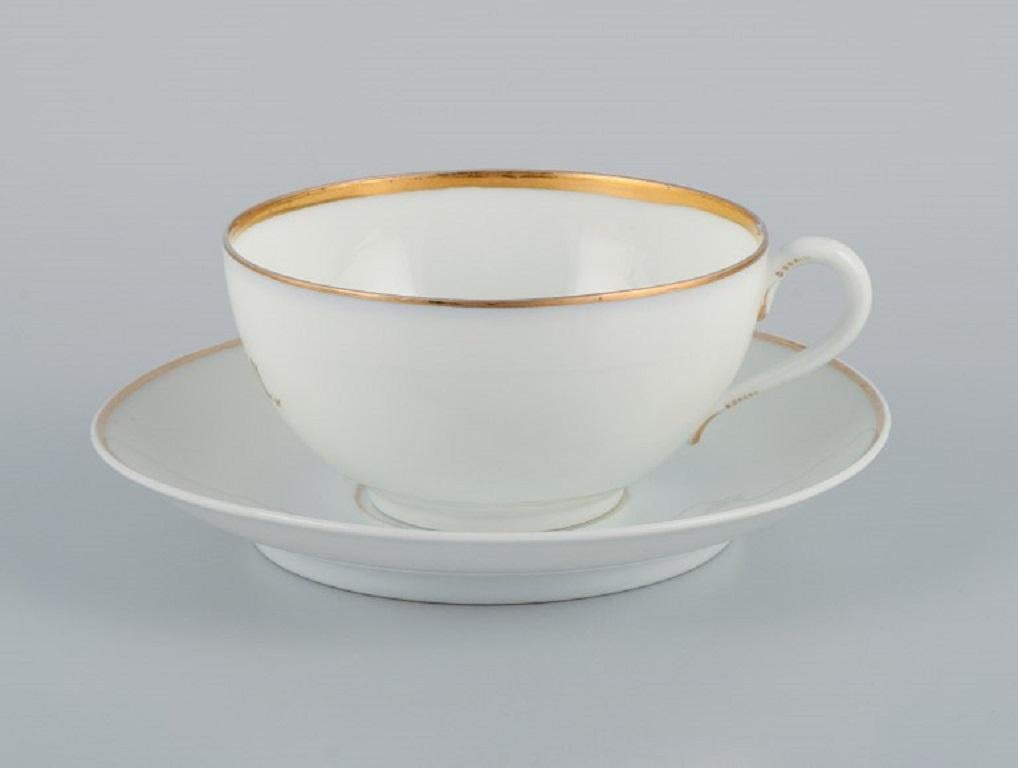 Rosenthal, Germany, a set of three large teacups and matching porcelain saucers. Thin white porcelain with gold decoration.
1903.
In excellent condition with no wear.
All cups with monogram 