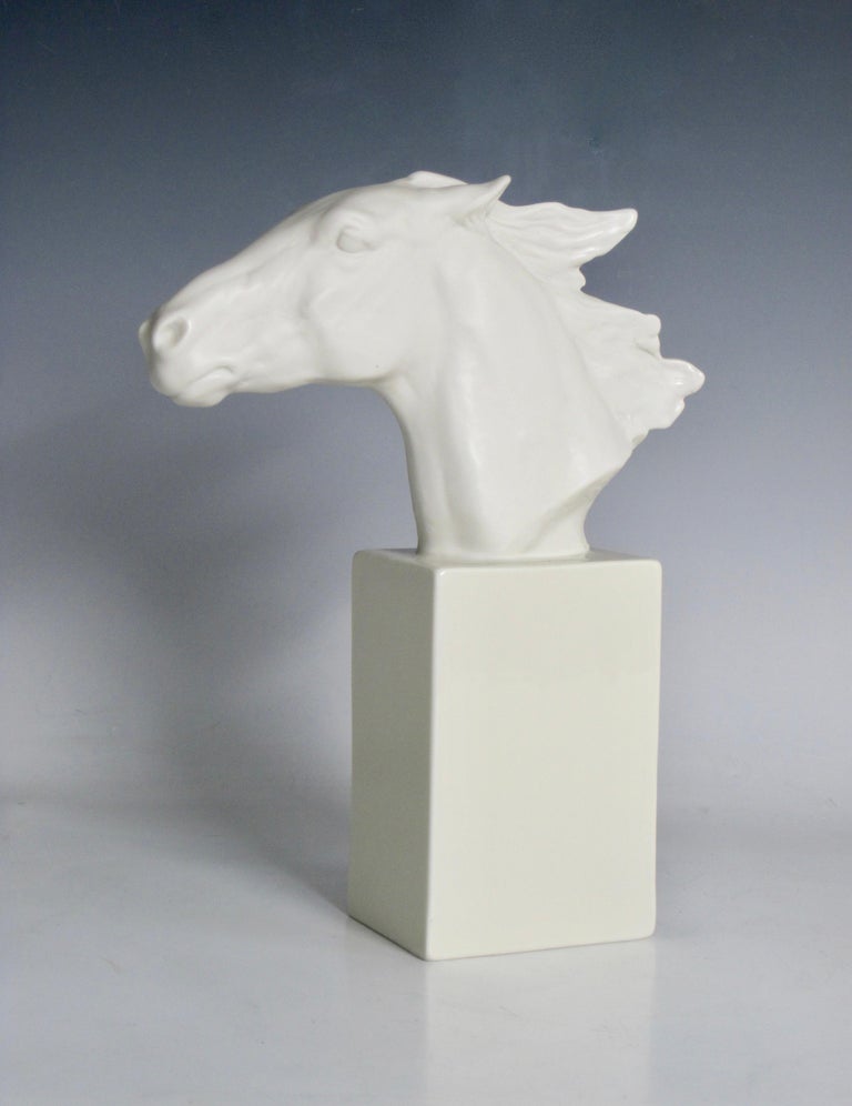 A Rosenthal horse head statue designed by Albert Hussman. What strikes me most about this piece, is the feeling of movement. By molding and modeling the porcelain, particularly around the mouth and mane, this all white sculpture shows great detail