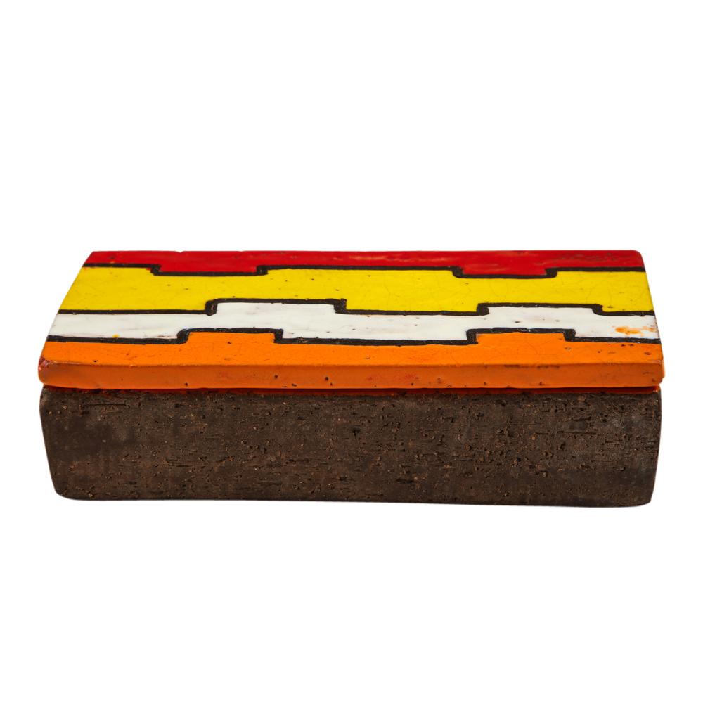 Rosenthal Netter Bitossi Ceramic Box Pottery Geometric Signed Italy, 1960s. The lid is decorated with a puzzle piece pattern glazed in red, yellow, white and orange; and is contrasted with a bottom of coarse matte brown clay. Named Líneas Rotas