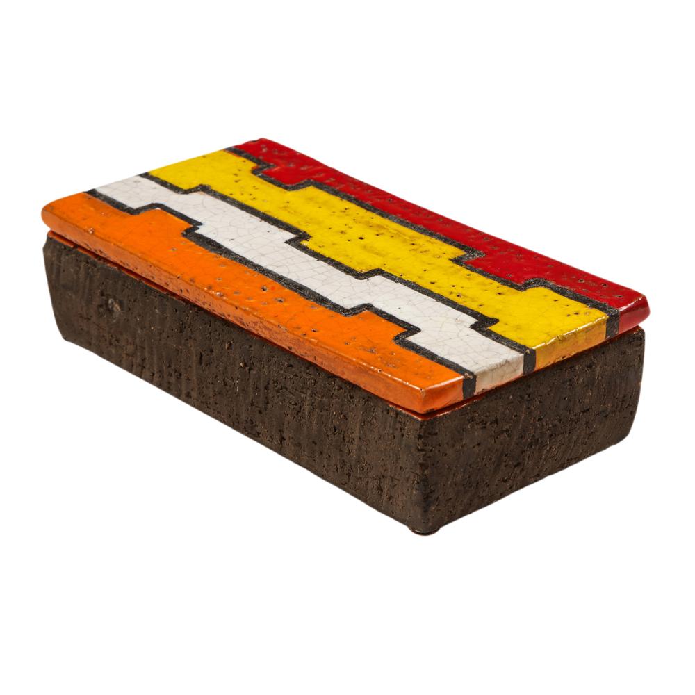 Bitossi box, ceramic, geometric, red, yellow, white and orange, signed. A small scale box from Aldo Londi's Líneas Rotas (Broken Lines) series. The lid is decorated with a puzzle piece pattern and glazed in red, yellow, white and orange. The bottom