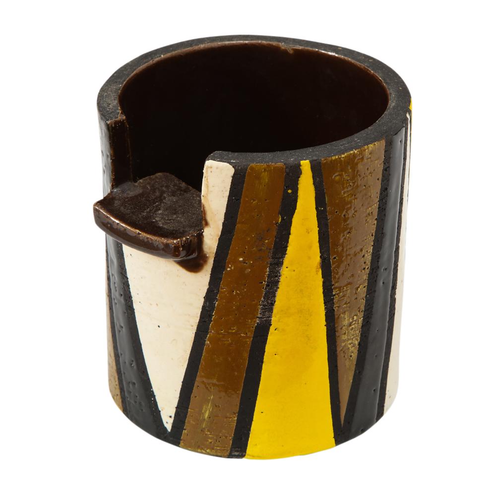 Rosenthal netter Bitossi cigar ashtray, yellow, black, white and brown, signed. Round cigar ashtray decorated with angular geometric pattern. The Rosenthal Netter label on the underside reads: Created in Italy for Rosenthal Netter Inc. 255/7.