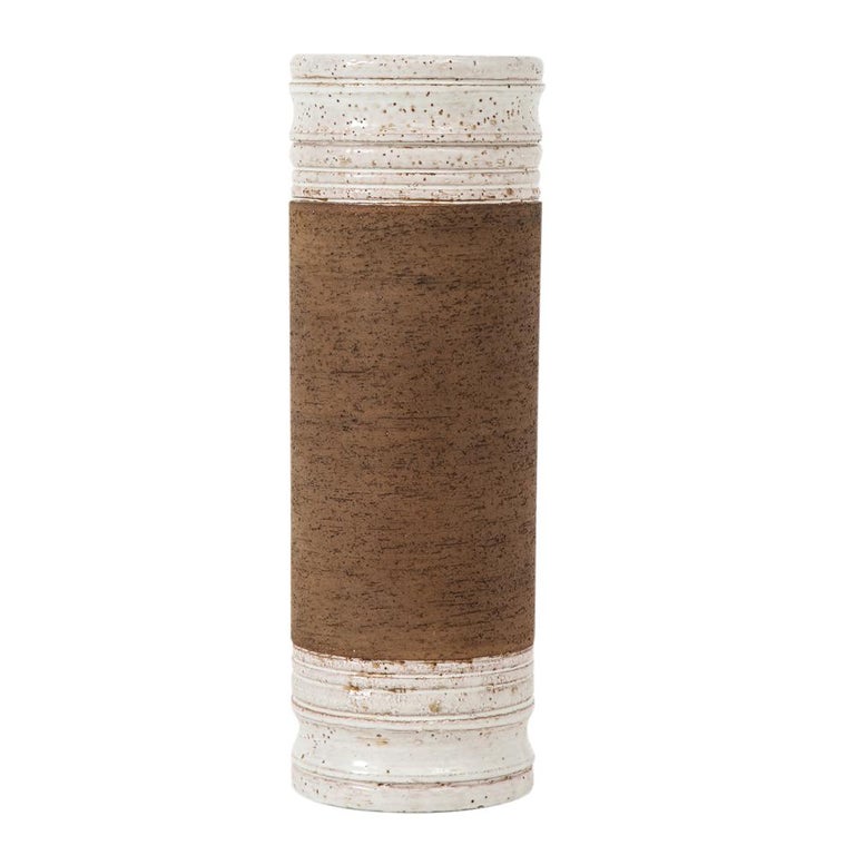 Bitossi for Rosenthal Netter vase, ceramic, brown and white, signed. Tall chunky cylindrical vase with neck and base glazed in white with brown specks and a raw matte clay center. Signed with a Rosenthal Netter paper label on the underside.