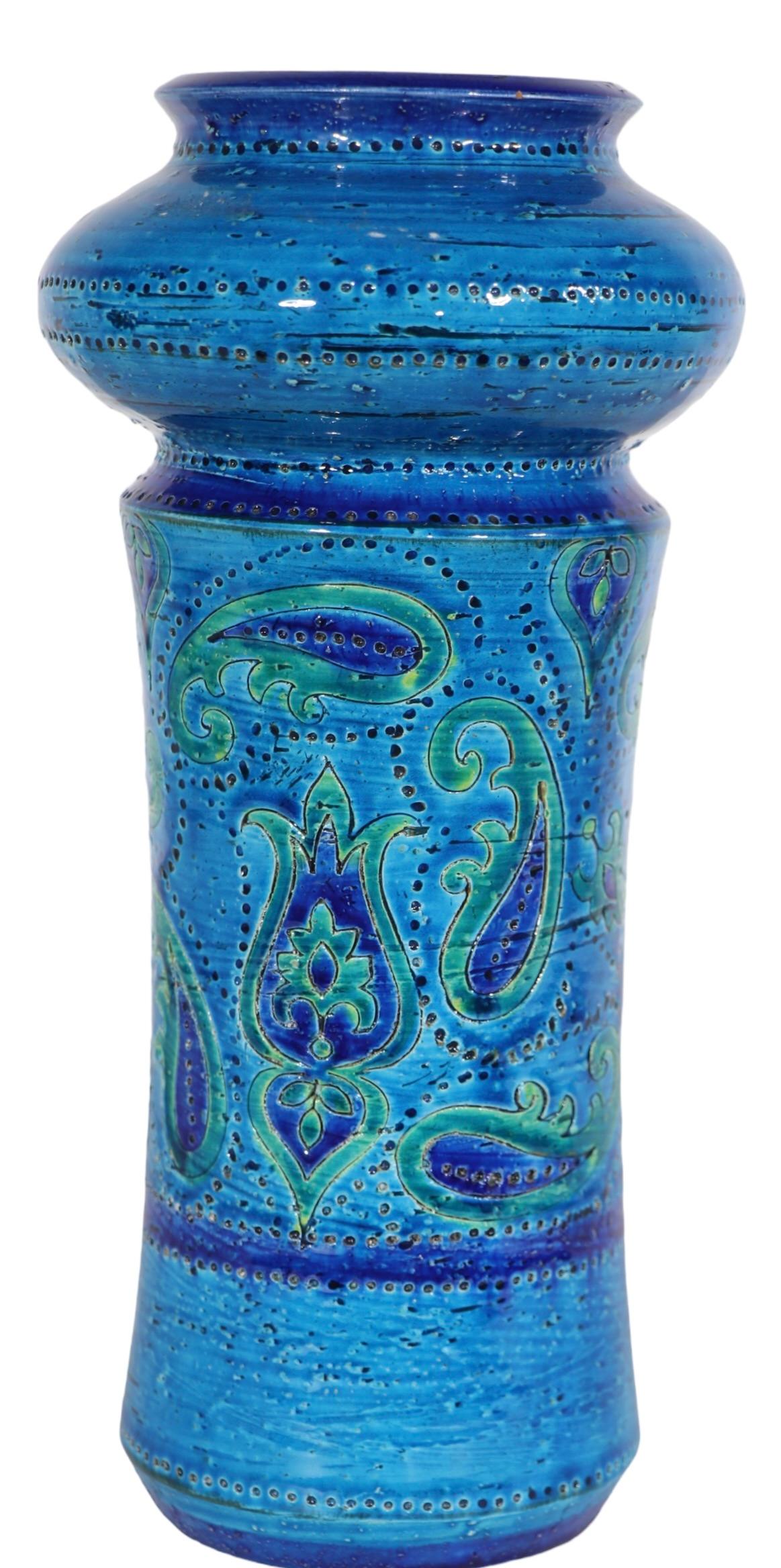 Classic Mid Century Italian pottery vase with incised decoration, signed Italy numbered, and retains its  original Rosenthal Netter paper label. The vase features the classic Rimini blue and green. glaze with paisley decorative motifs. Circa