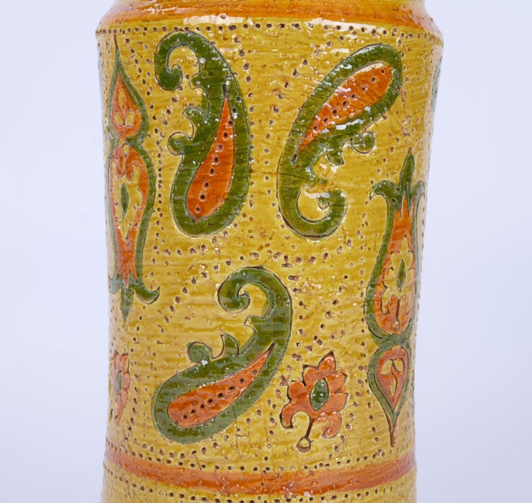 Rosenthal-Netter Mid-Century Modern glazed ceramic vase made in Italy.
A vintage glazed ceramic vase in a mustard yellow with paisley motifs, by Rosenthal-Netter. Marked and Numbered underneath.