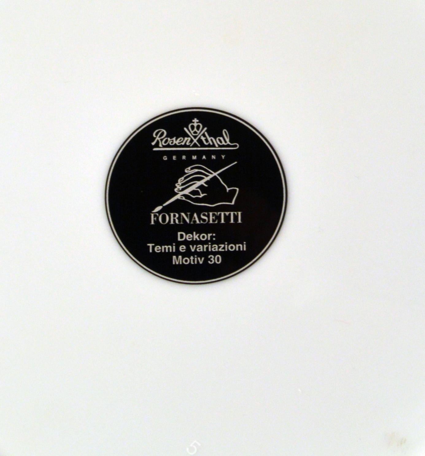 Rosenthal Piero Fornasetti Themes & Variation Porcelain Plate Motiv 30-Flowers,
1980s
  

The striking Rosenthal Fornasetti gold-rimmed black and white printed plate with the face of Lina Cavalieri depicted with a garland of flowers around her