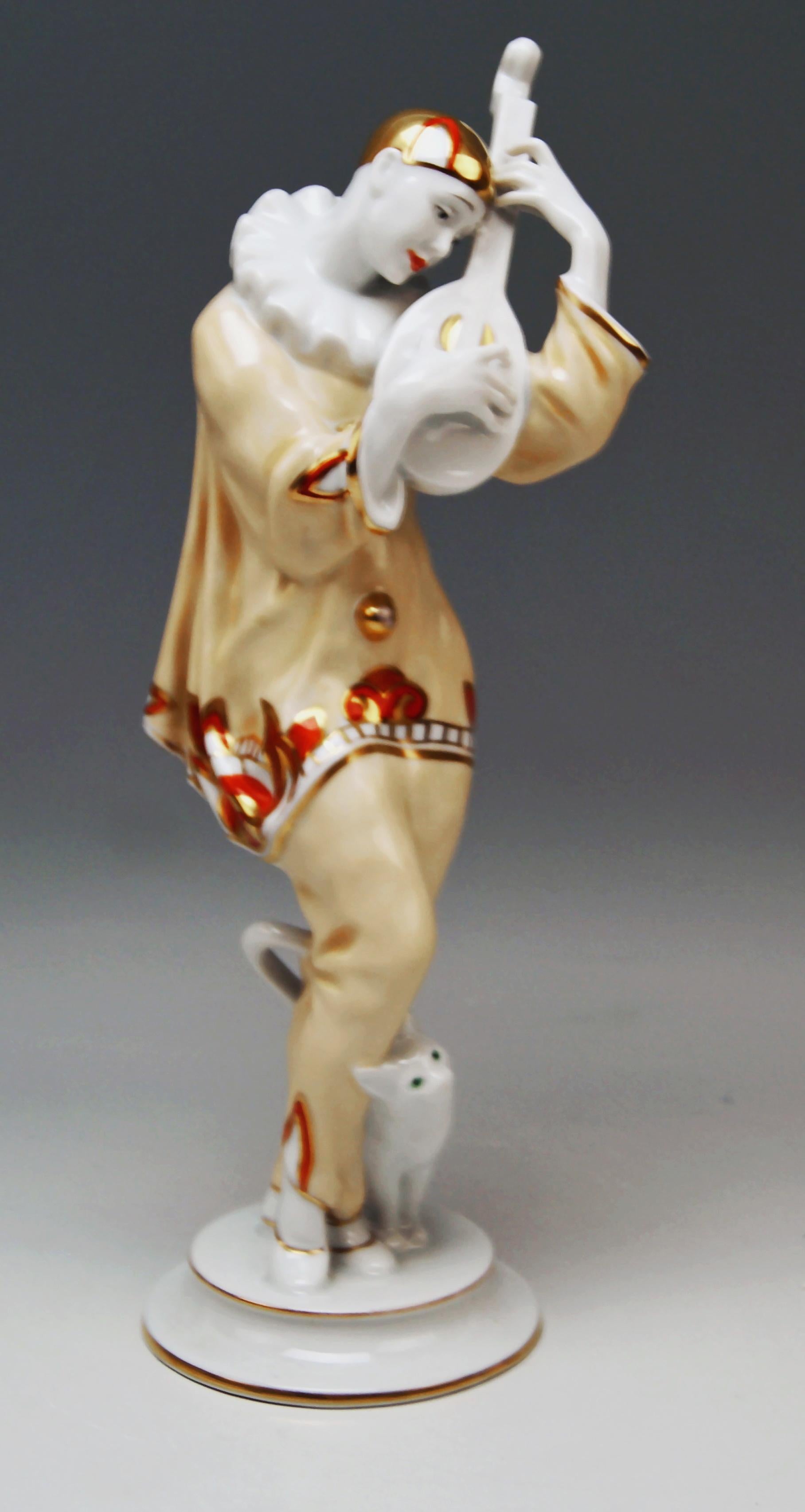 Rosenthal Rarest Art Deco Figurine Of A Pierrot:
A gorgeous rarest Pierrot Figurine - Called 'ASH WEDNESDAY' - wearing a Pierrot's costume (ruff, cap, a loose-fit shirt and trousers) plays the lute / a lovely cat nuzzles up against Pierrot's legs.