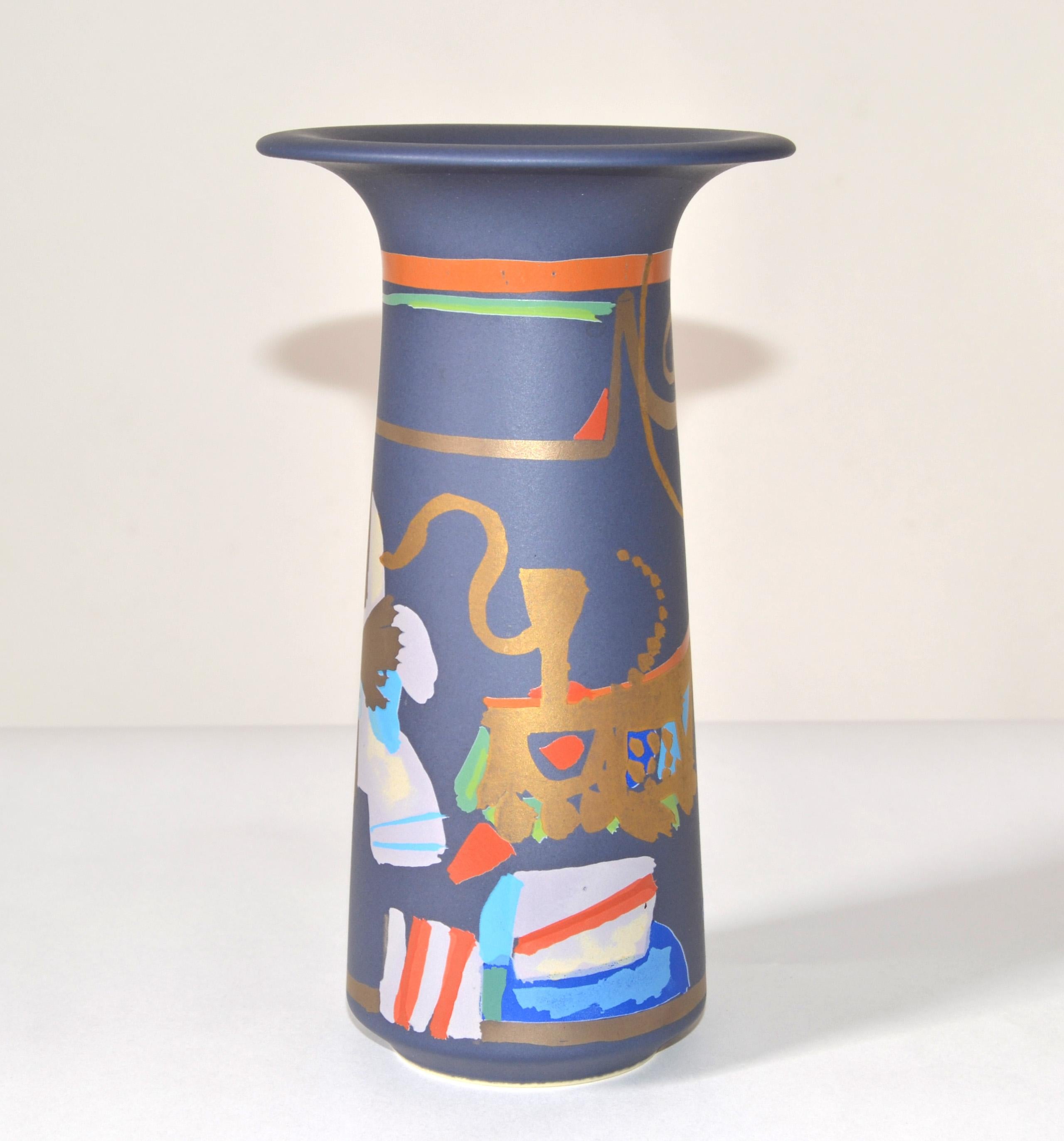 Striking original Rosenthal porcelain hand painted flower vase Series LIGURIA designed by Gilbert Portanier and made in Germany for Studio-Linie.
The vase features multi-color abstract designs with gold on a matt dark lilac blue ground. 
Signed