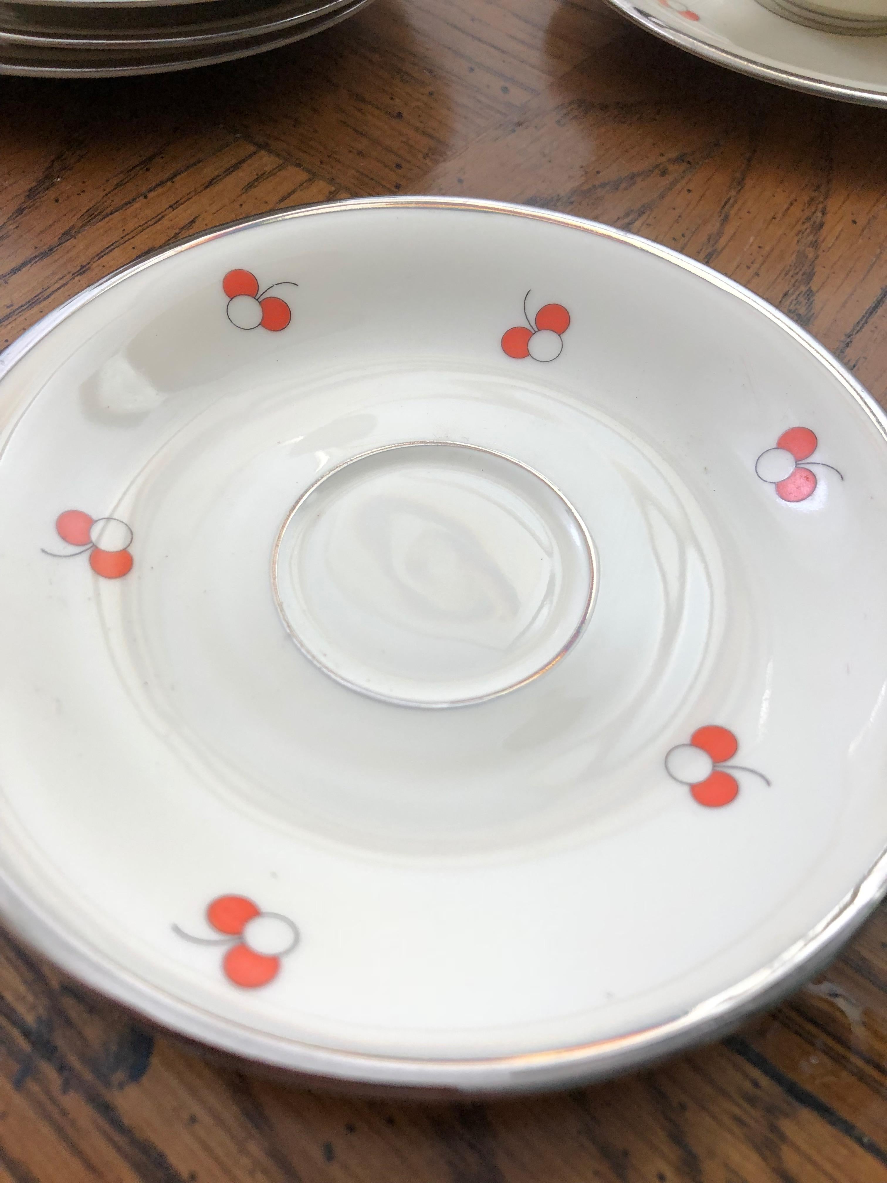 Adorable and extremely rare dematisse set in original case. White with red and white cherry triplets with chic charcoal grey rim. All pieces marked. Mark corresponds to the years 1925-1939. During this time Rosenthal was imported to the US at high