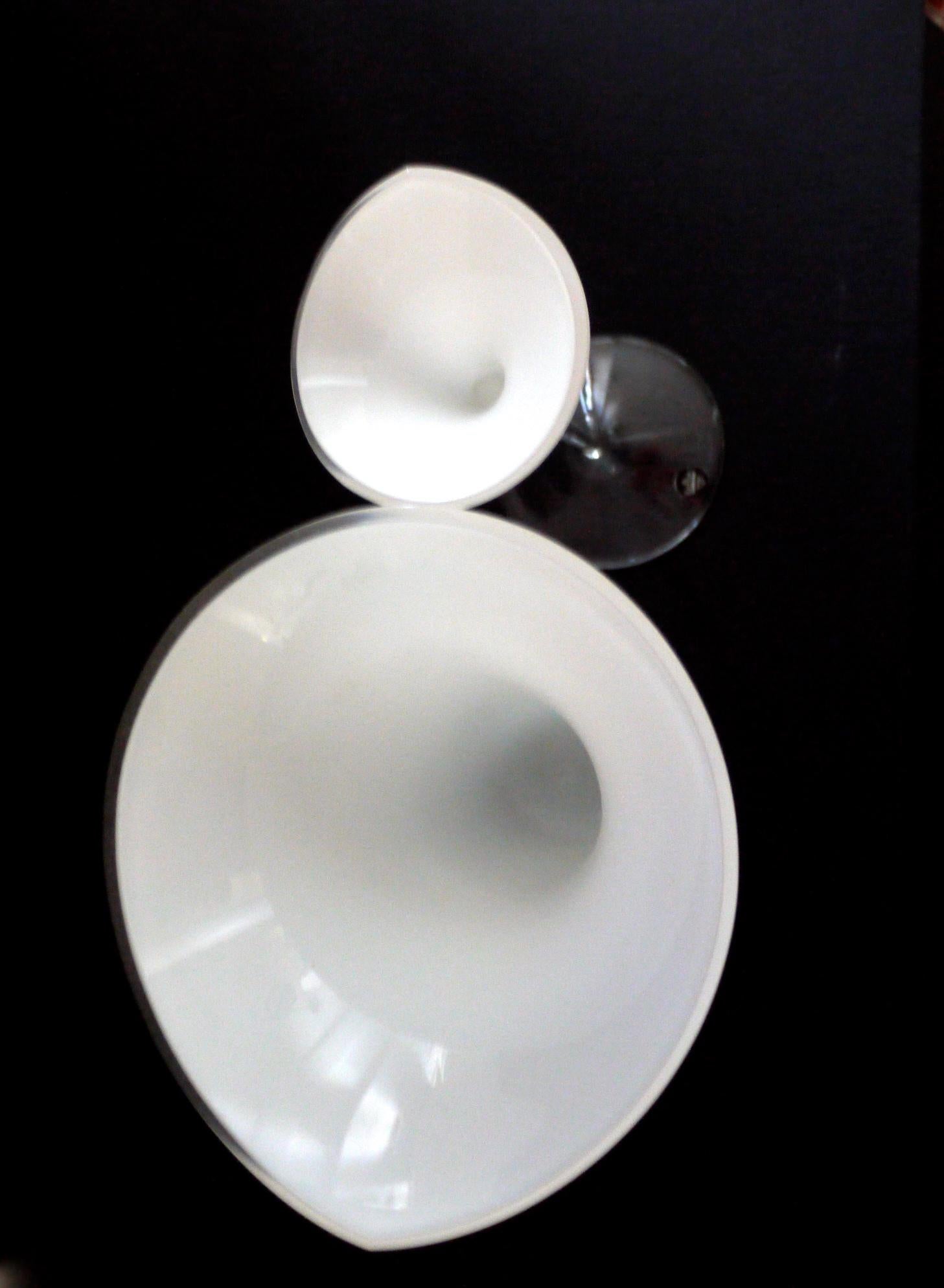 Pair of white lily vases/sculptures from Rosenthal Studio, Germany. The smaller one has the original label.
The Studio line is a subset of the Rosenthal brand and was created in the 1960s and many famous artists and designers have created works for
