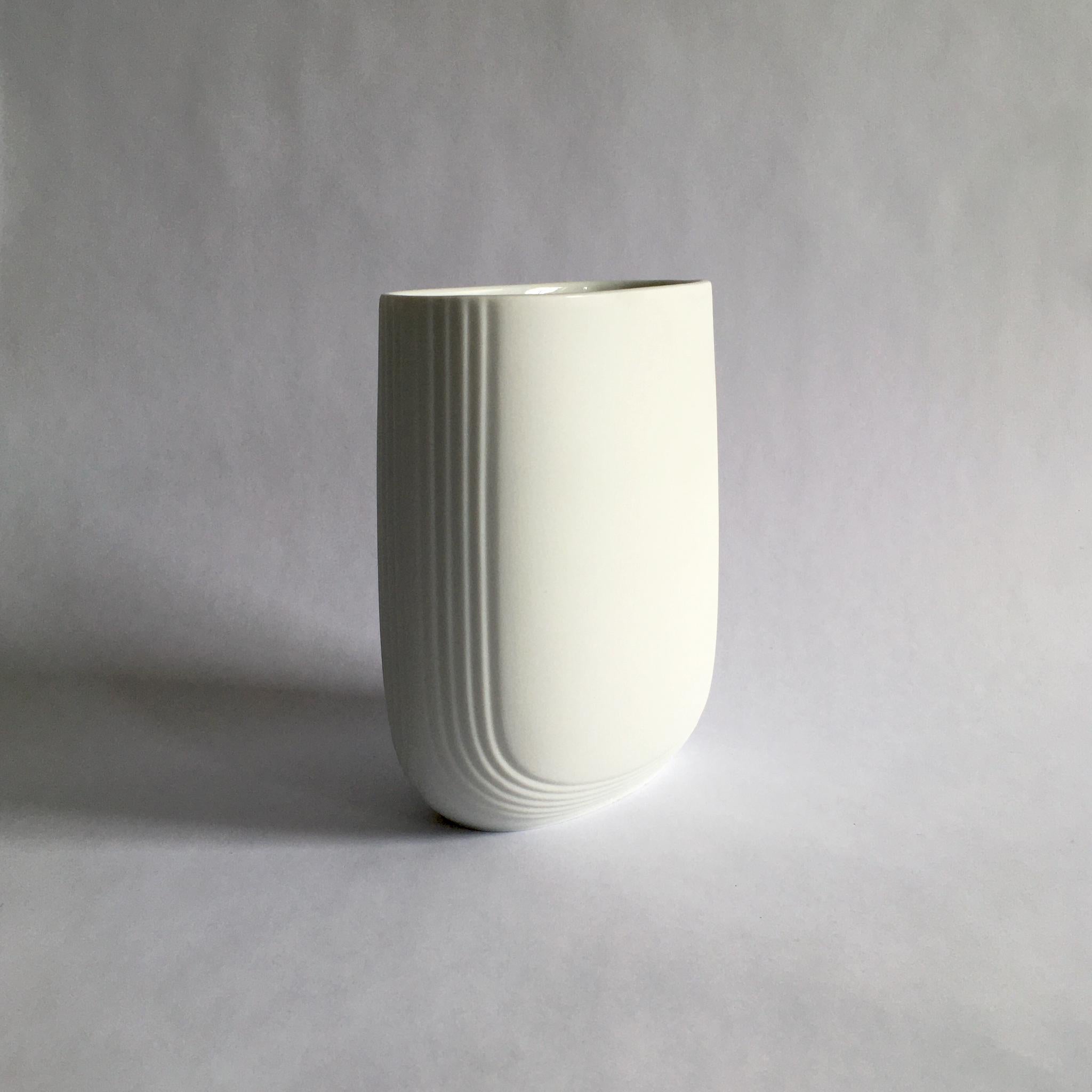 Rosenthal Studio Line white porcelain bisque vase by Christa Hausler-Goltz. Beautiful rounded oblong form, with linear details.

Measurements:
H 5.5