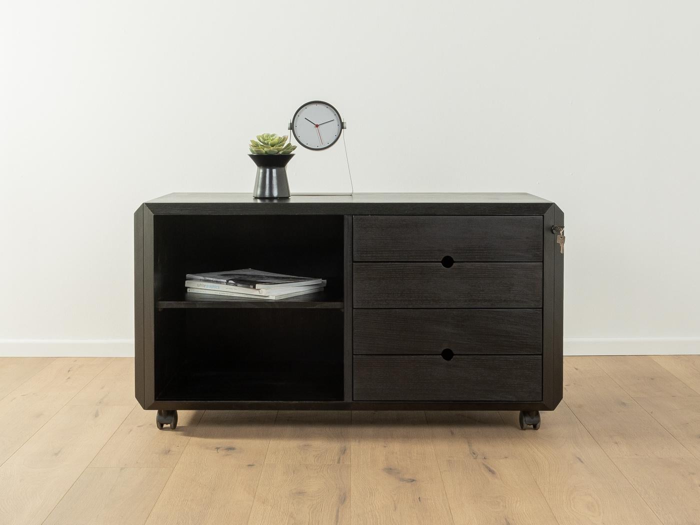 Talete dresser from the 1980s by Pierluigi Ghianda and Gabriele Regondi for Rosenthal. Solid frame and four lockable drawers made of black-stained ash with one shelf and plastic castors.

Quality Features:
 very good workmanship
 high quality