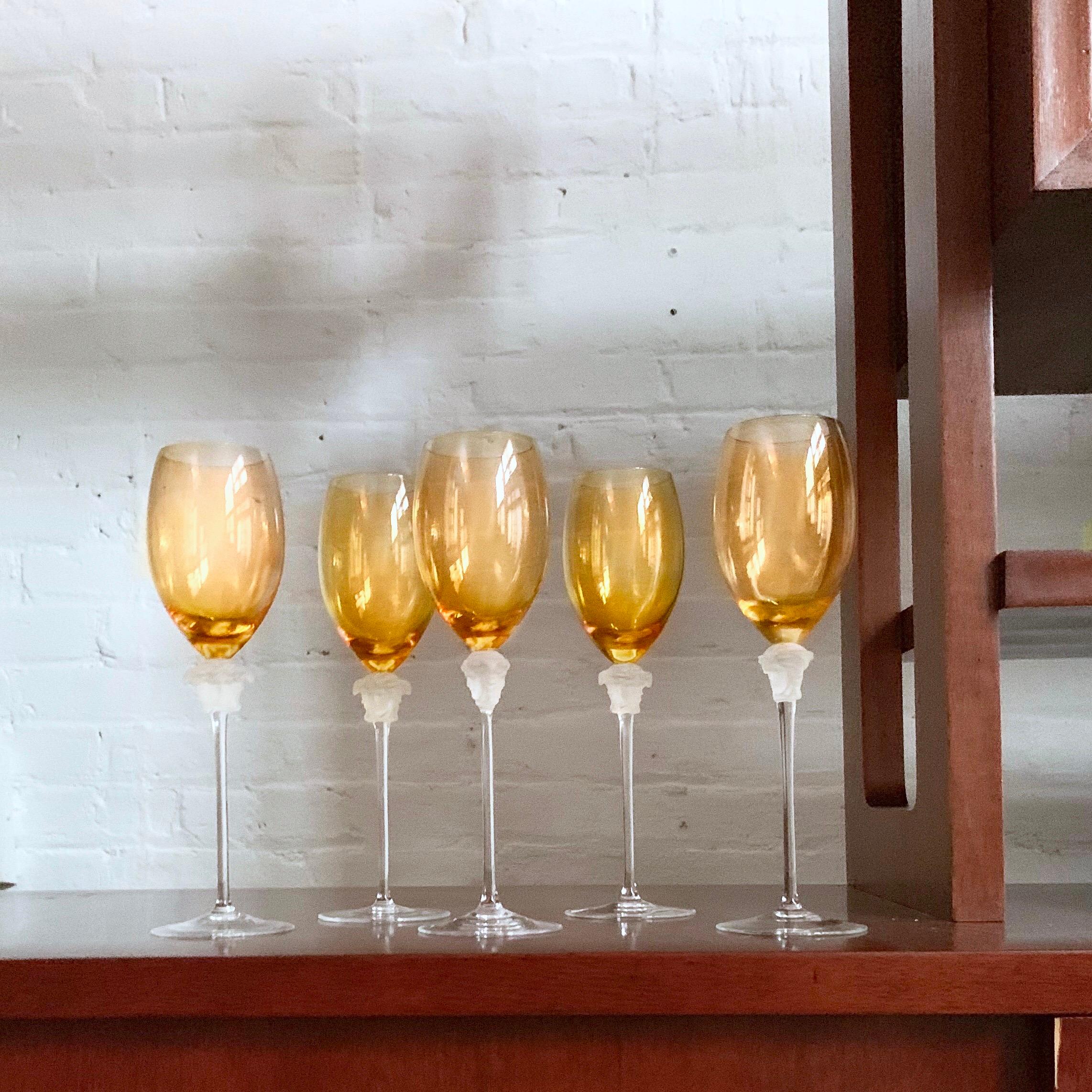 Rosenthal Versace Medusa Lumiere amber crystal wine glass, white, frosted stem. Stunning long stem crystal white wine glass manufactured by the Rosenthal Glass Company. 

The wine hock stands approximately 10 1/4