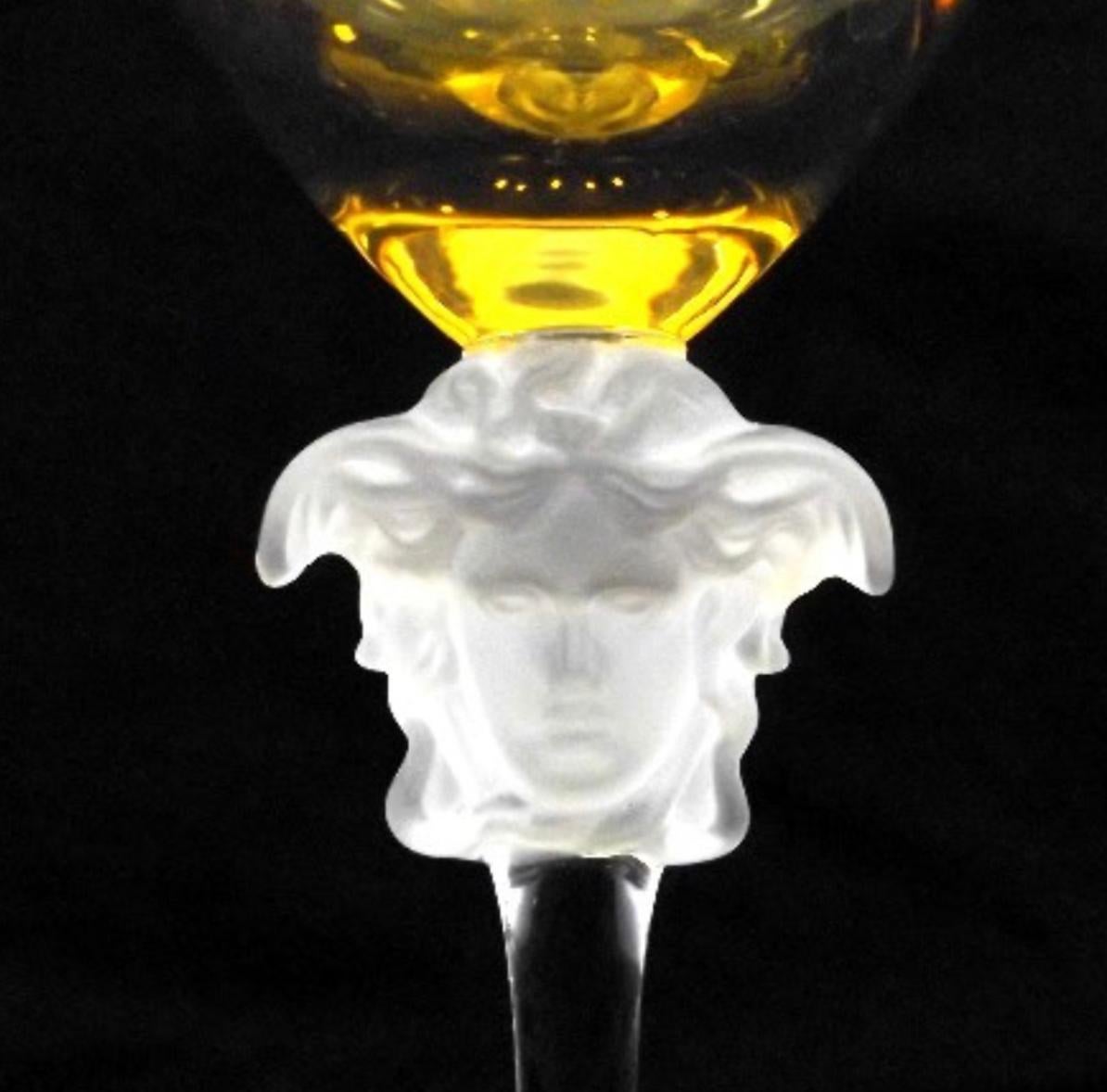 Rosenthal Versace Medusa Lumiere amber crystal wine glass, white, frosted stem. Stunning long stem crystal white wine glass manufactured by the Rosenthal Glass Company. 

The wine hock stands approximately 10 1/4