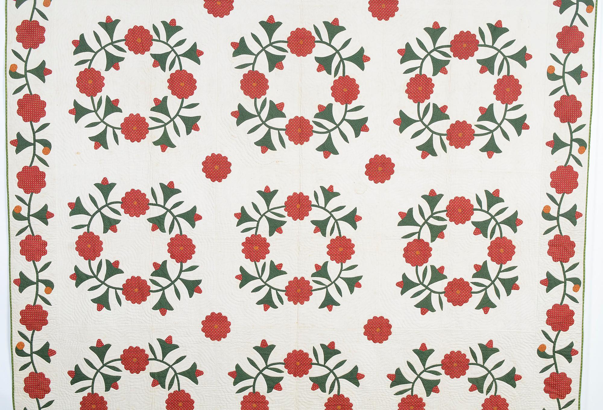 Dozens of varieties of floral wreath quilt patterns were popular in the 19th century. Unlike most such patterns, this example includes bells between the flowers. It is finely appliqued and well quilted with echo patterning. The quilt is in