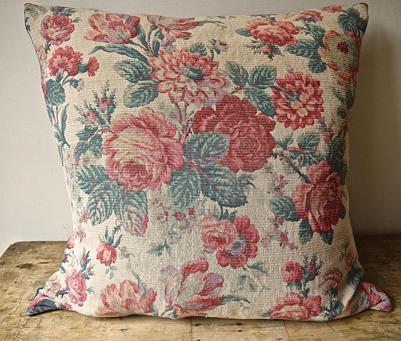 French early 20th century textured linen cushion with a large-scale design of a roses and tulips in pretty soft colors.
Backed in a hand-dyed French 19th century linen. Slip-stitched closed with a duck feather cushion pad.