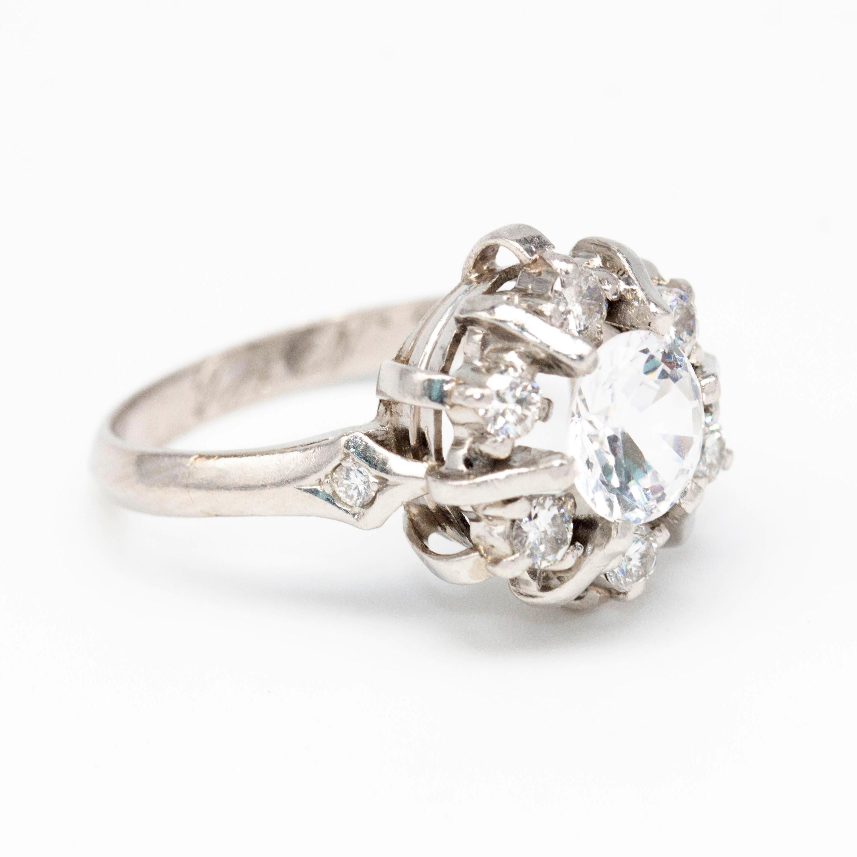 White Gold Ring with Diamonds and Beryl for woman  6x Brilliant Cut Diamonds with total weight approx 0,50 ct and 1x colorless Beryl of 7mm and weight approx 1,45ct  Size 12,5  18 kt White Gold  7,32 grams  Jewel of second hand in perfect state of